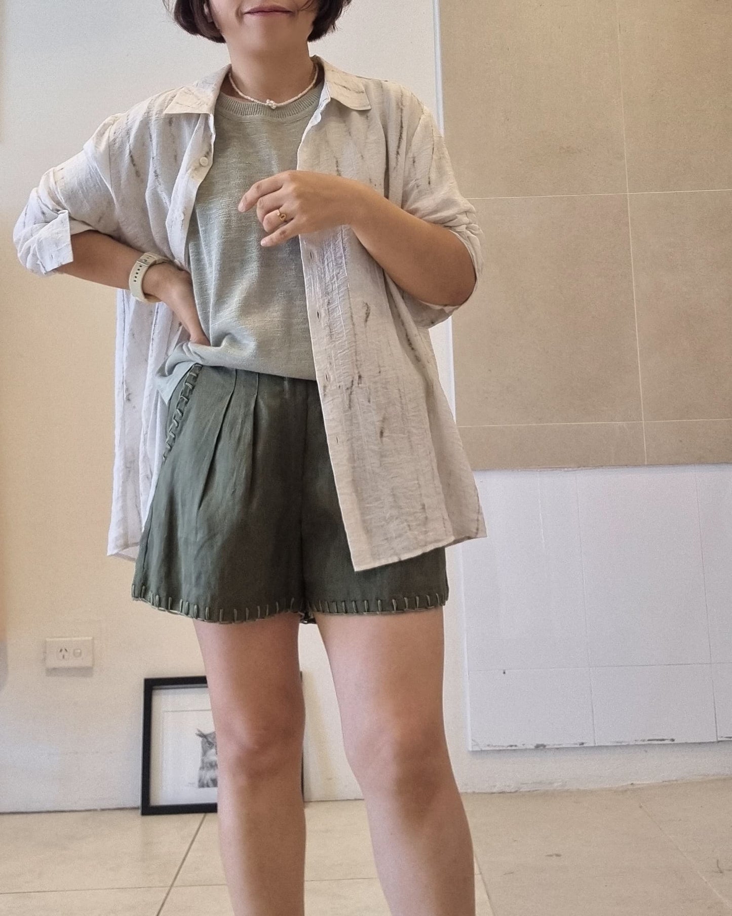 Soft green viscose knit top layered with light linen shirt, relaxed fit casual styling