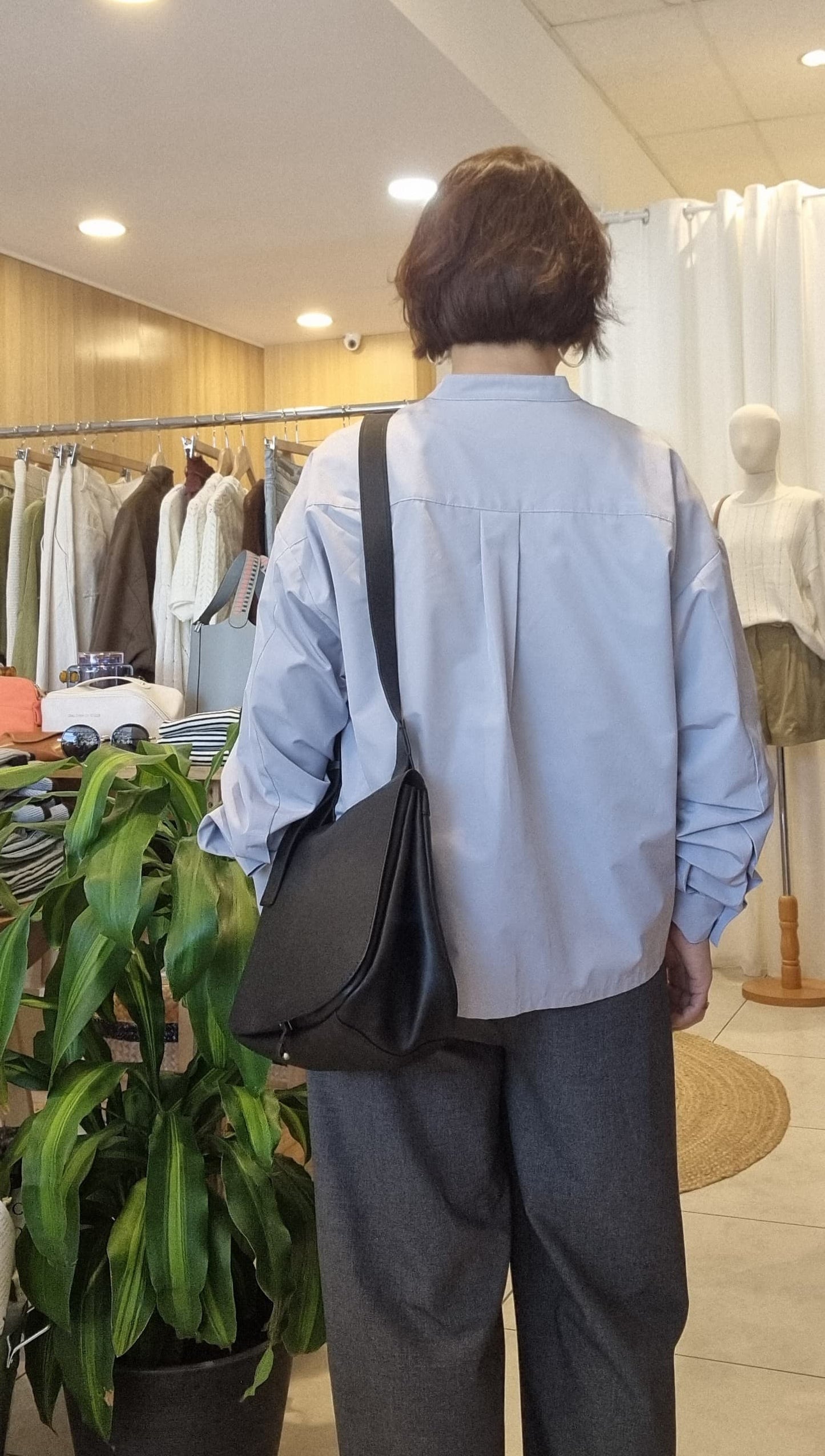 Back view of Cloud Blue Ribbon Top showing clean and simple back design