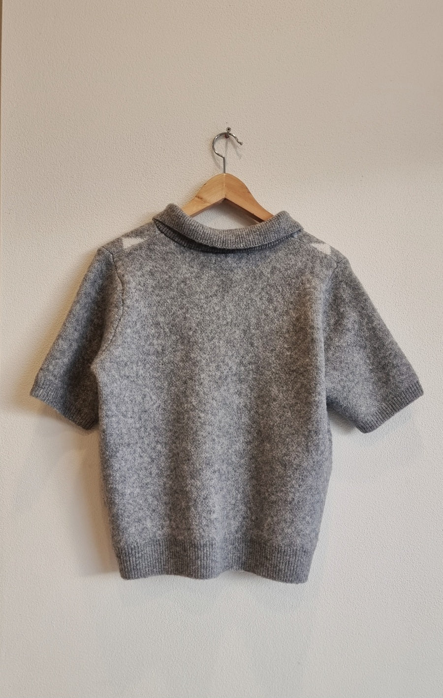 argyle knit short sleeve sweater back view on hanger