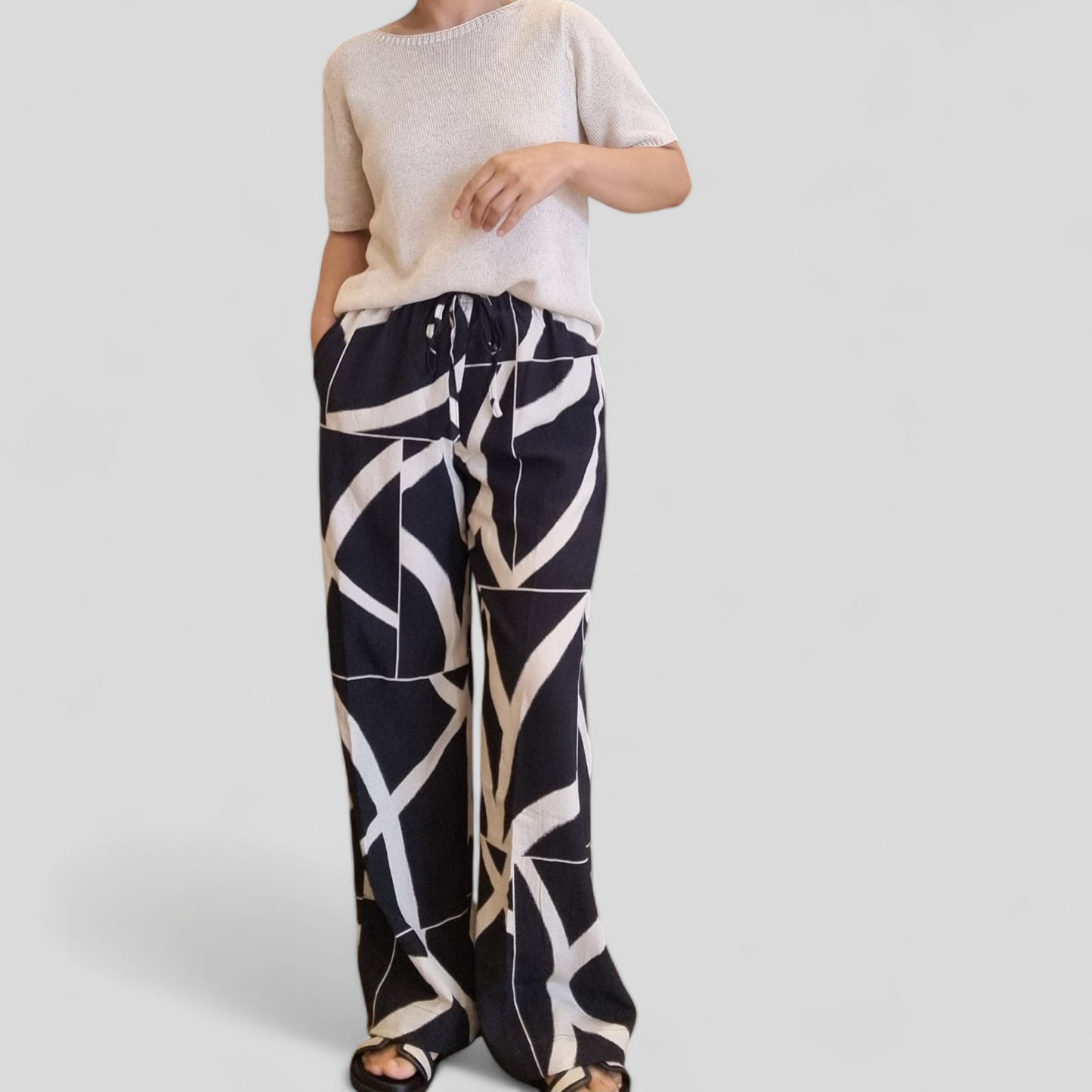 Back view of summer knit top styled with pants – Nova Lux