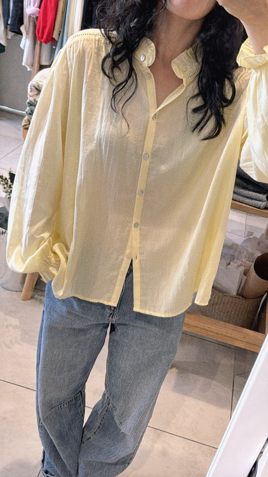 Model wearing white cotton blouse front view