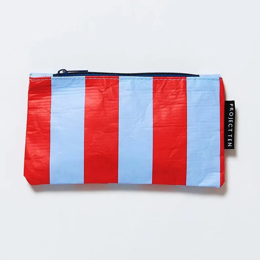 "Stripe Tiny Zip Pouch in red and blue stripes with a black zipper, displayed on a light background"