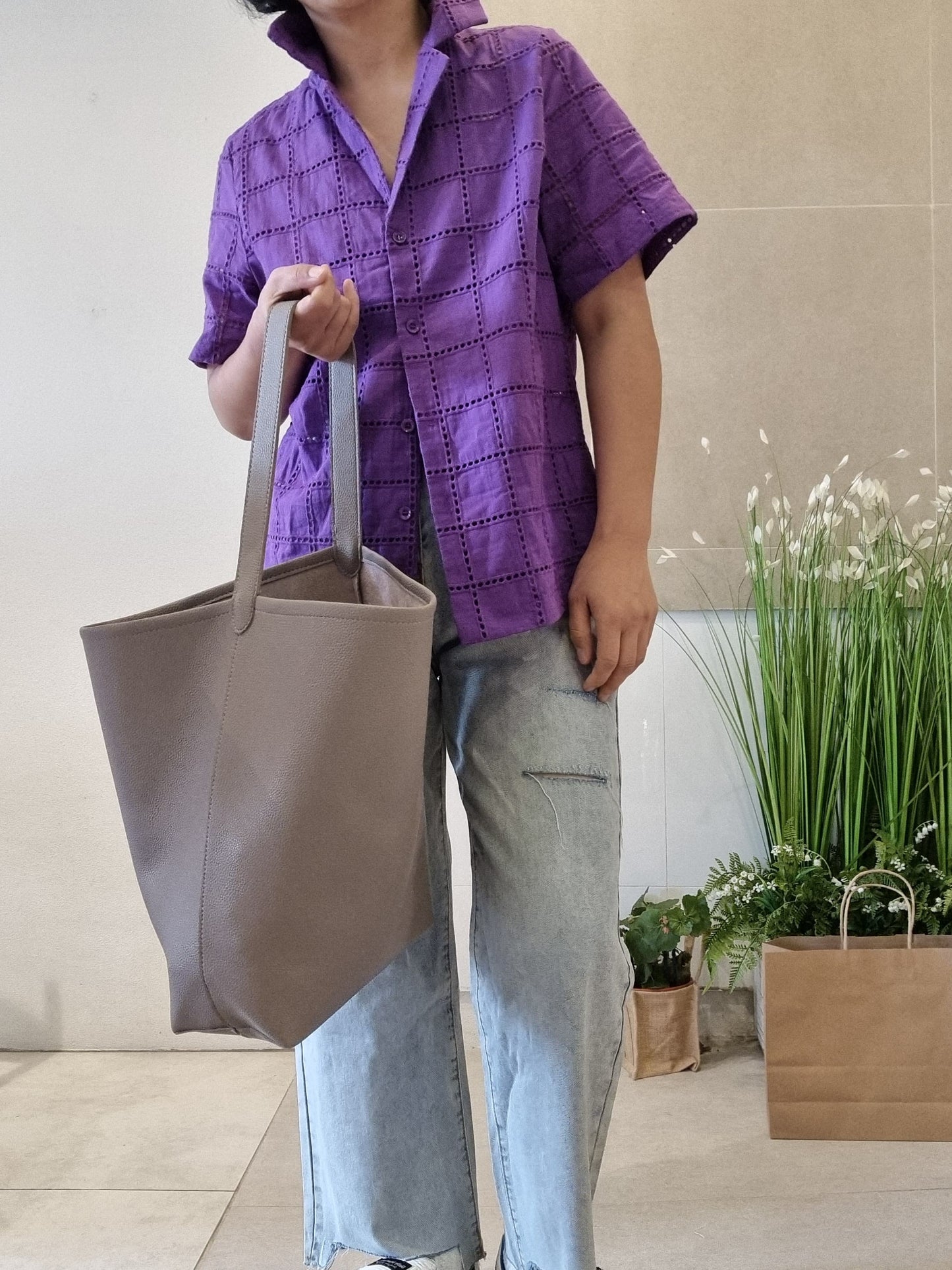 Model carrying bag wearing HAYLIE SHIRT
