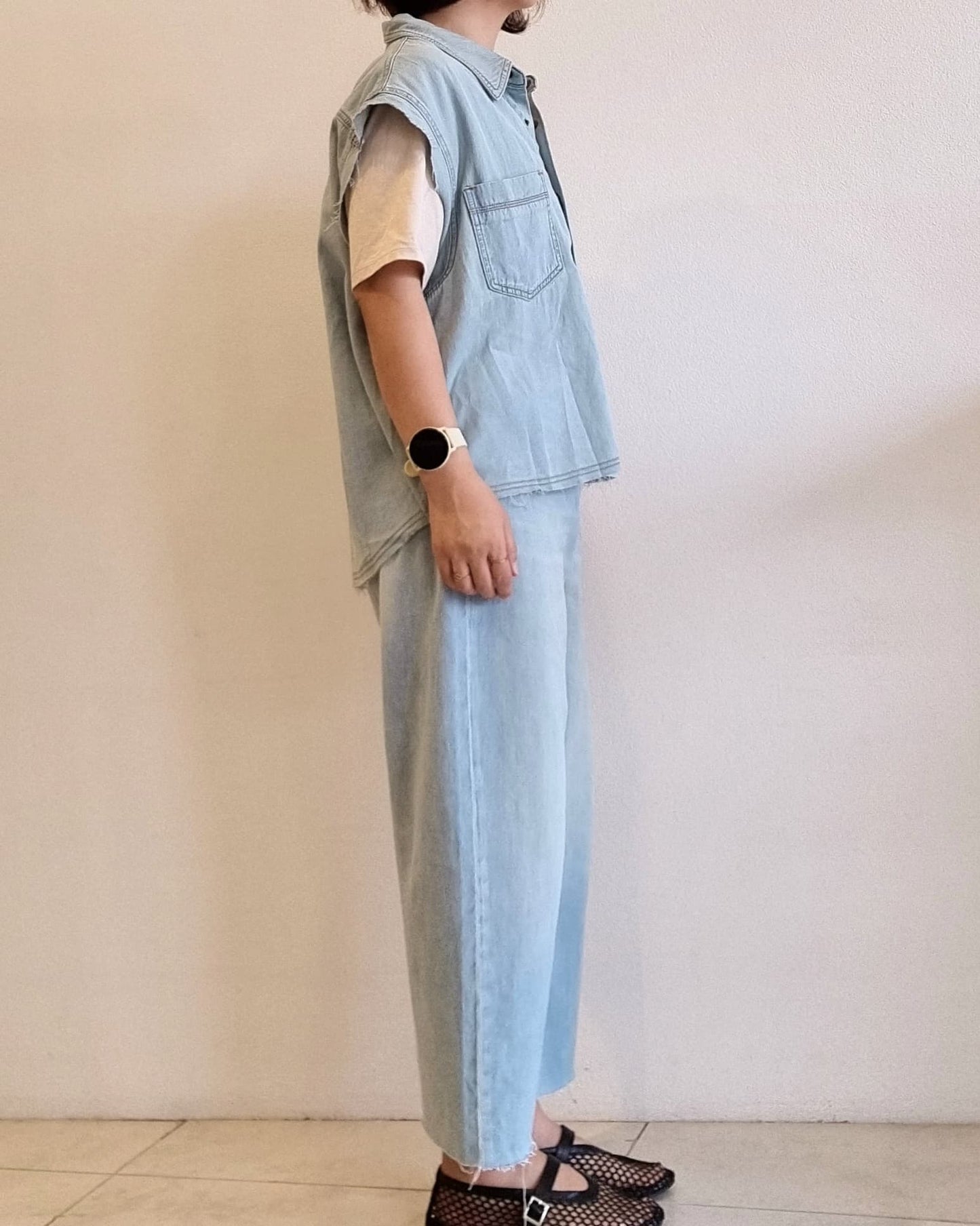 Light denim cotton vest, right side view showing boxy silhouette.