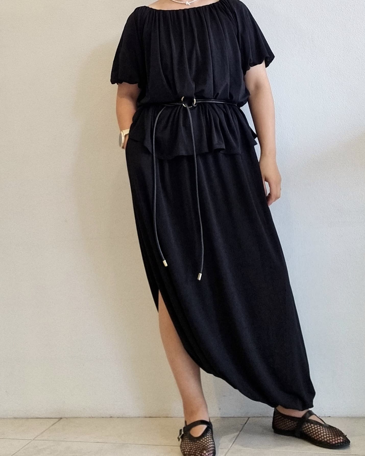 Close-up of top detailing from the Seren Black Draped Set