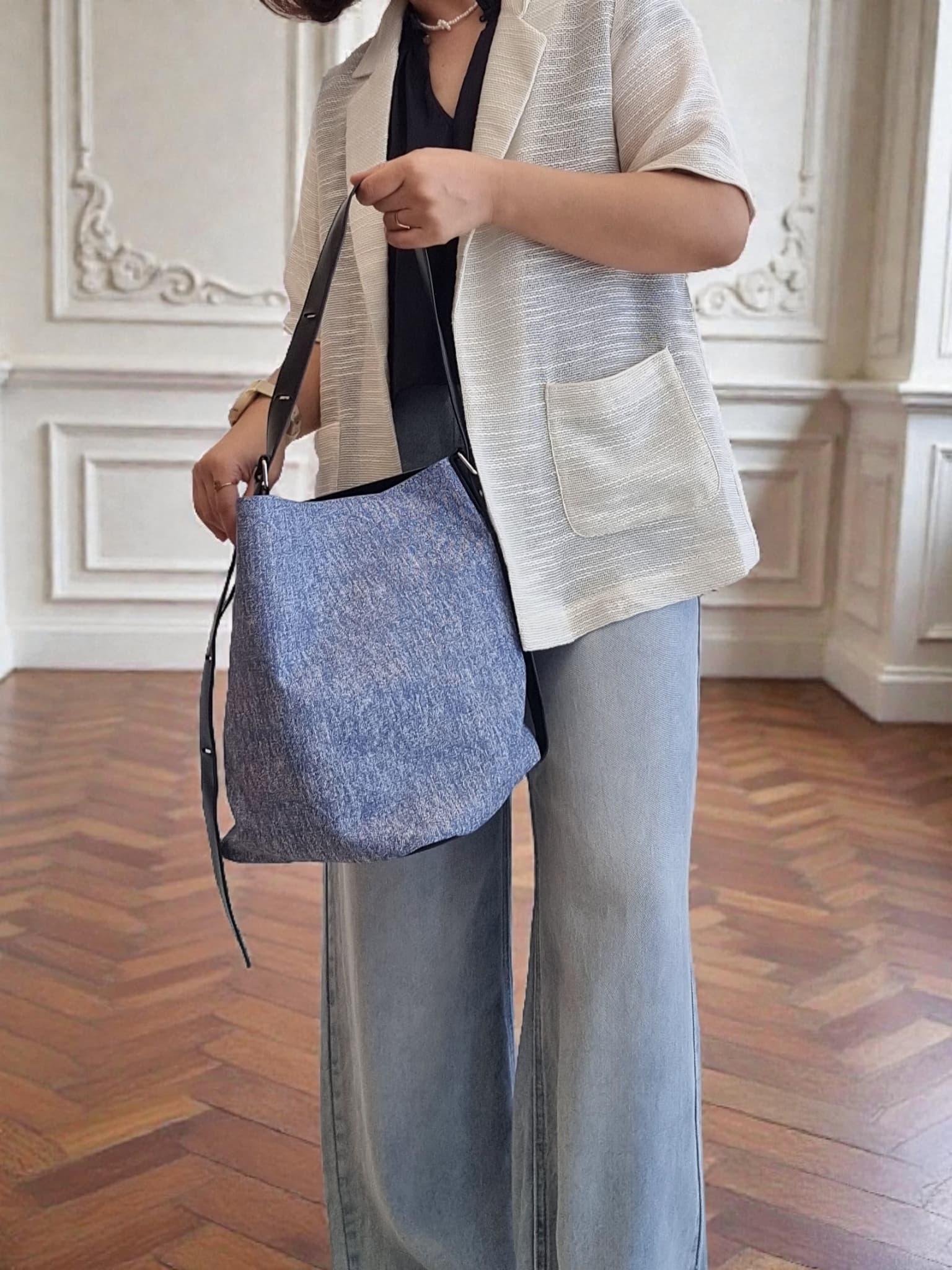 Isadora Jacket with blue shoulder bag – side pose