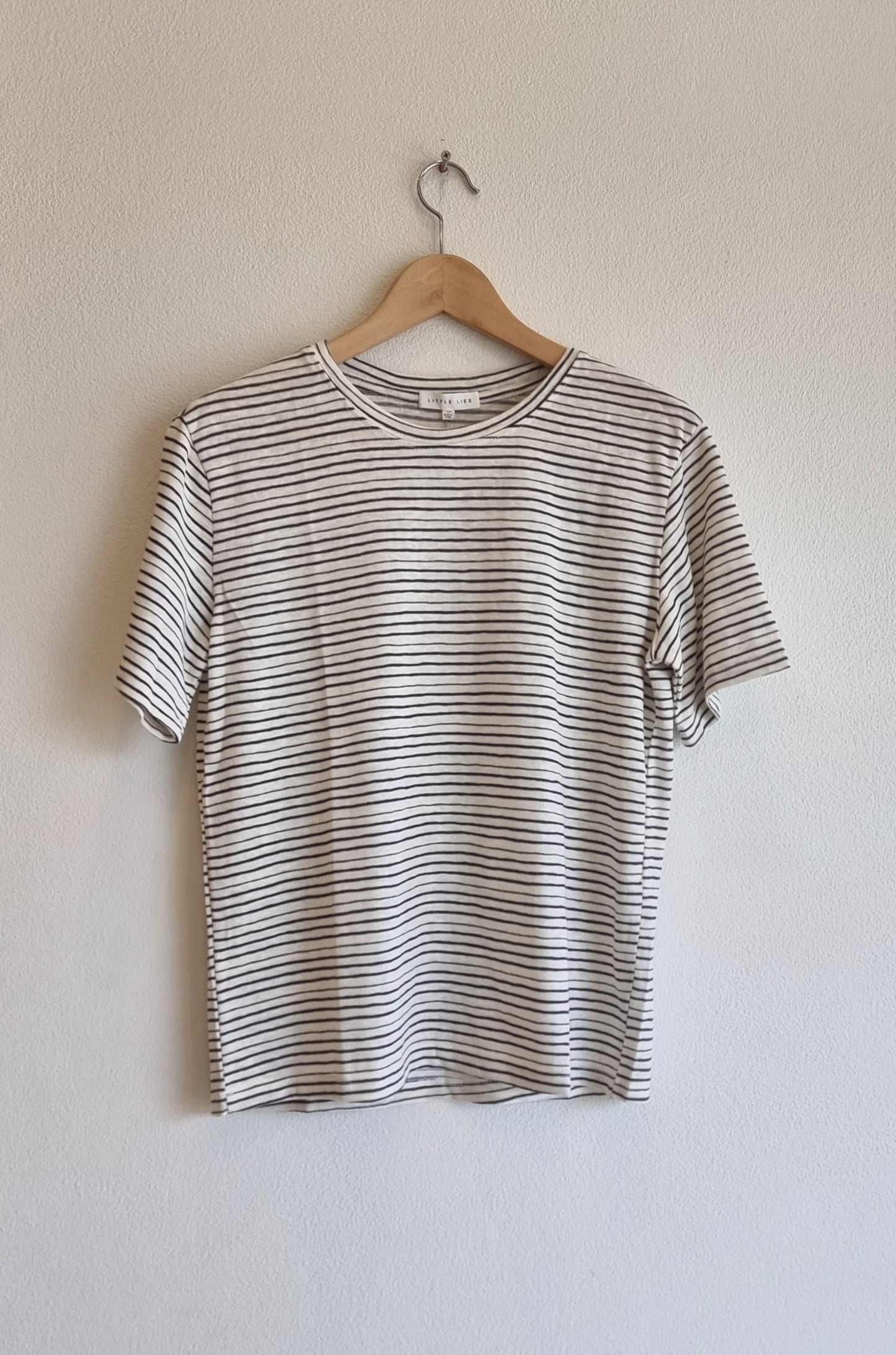 Classic black stripe cotton linen t-shirt on hanger, lightweight breathable fabric