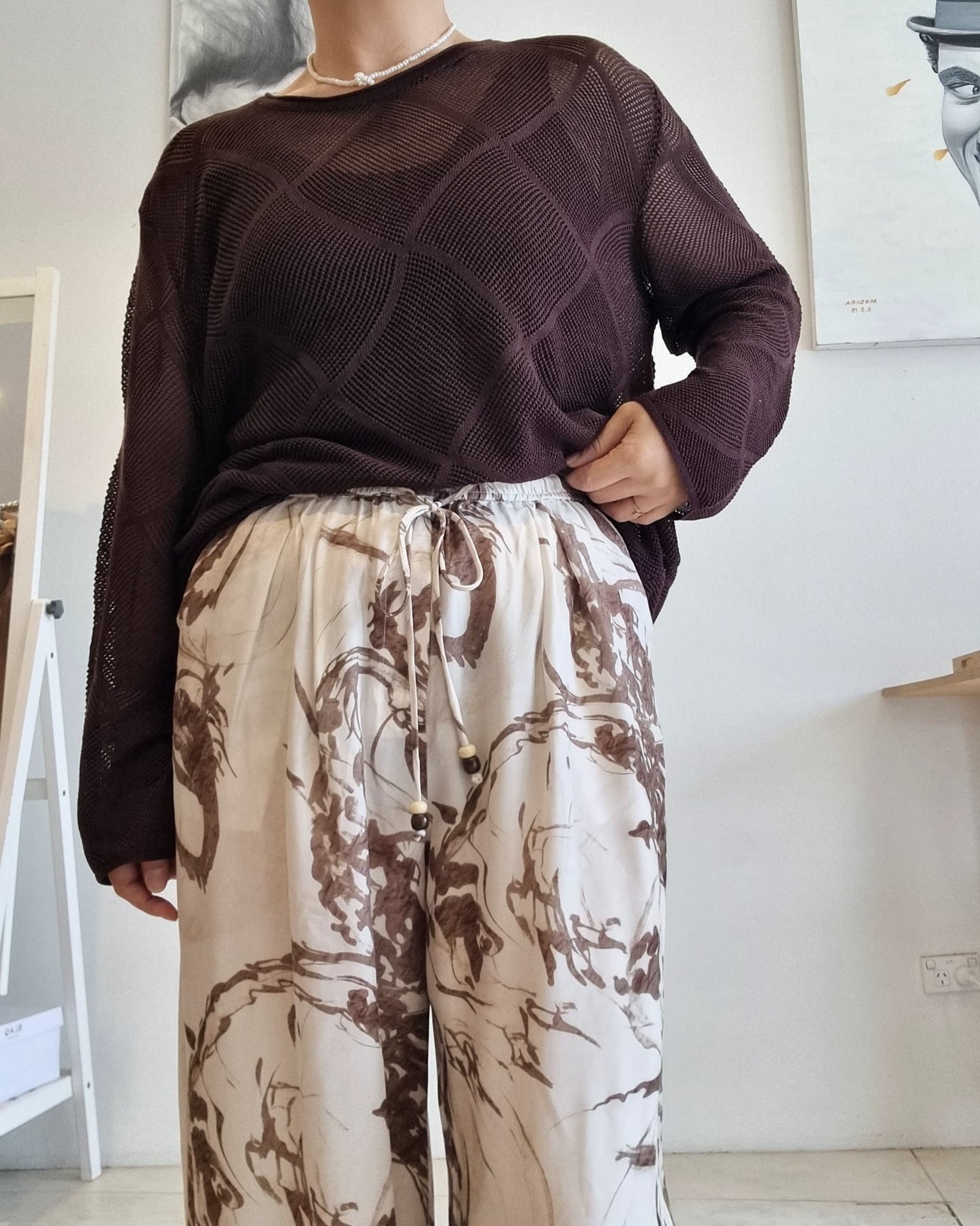 Brown Tencel mesh knit long-sleeve top styled with printed beige pants.