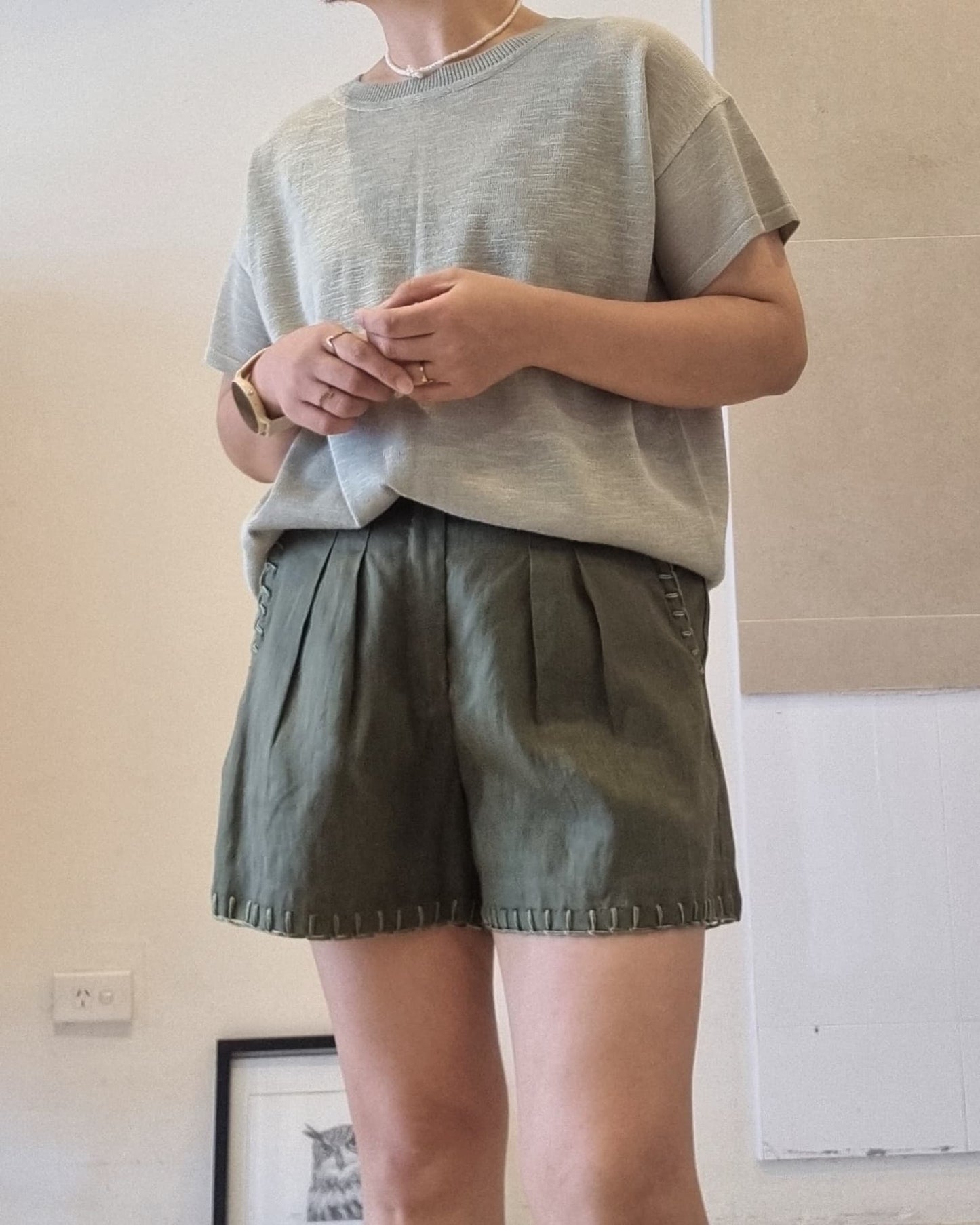 Soft green viscose knit top styled with matching green shorts, relaxed fit front view