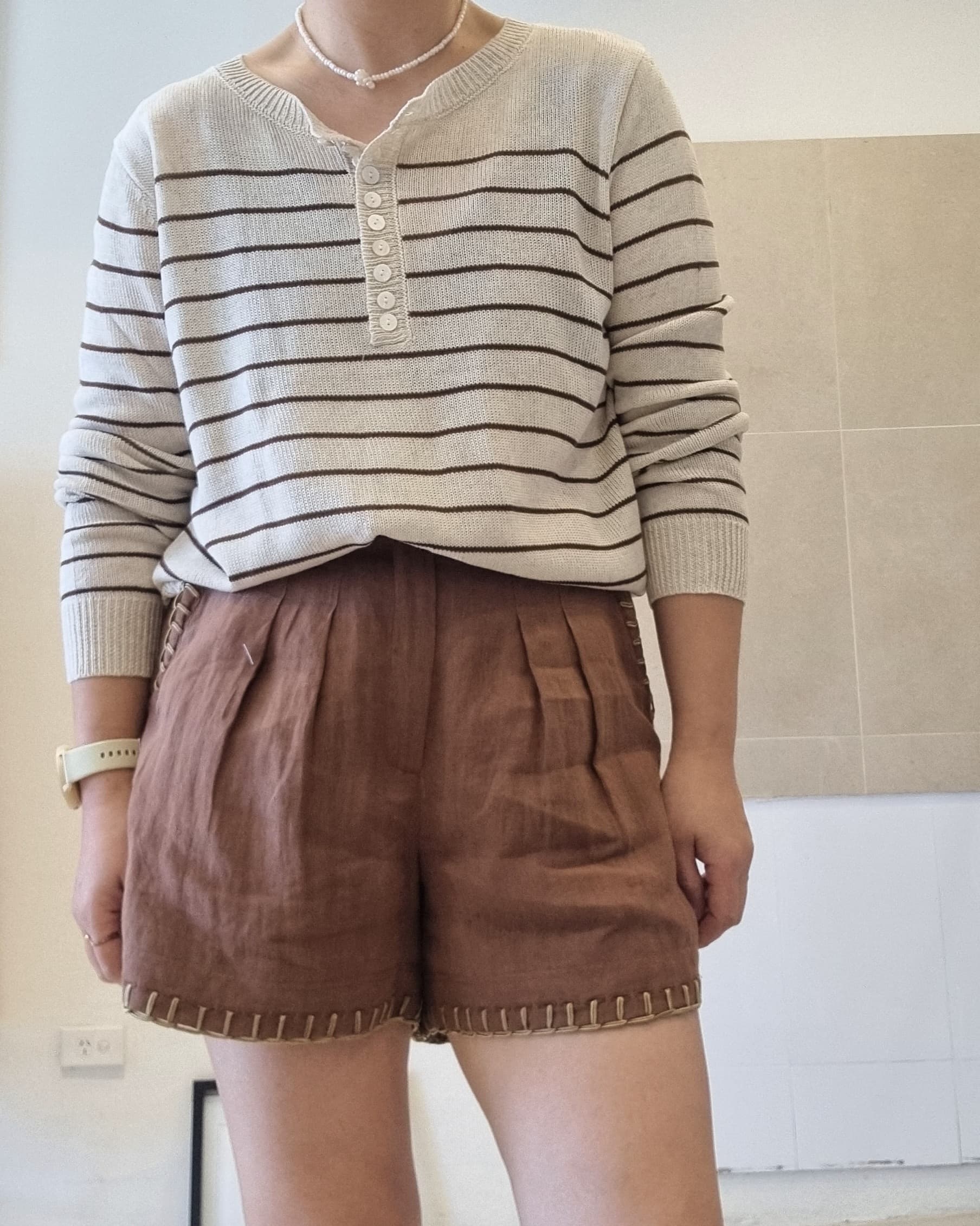 Striped cotton linen long sleeve top styled with brown shorts, relaxed fit