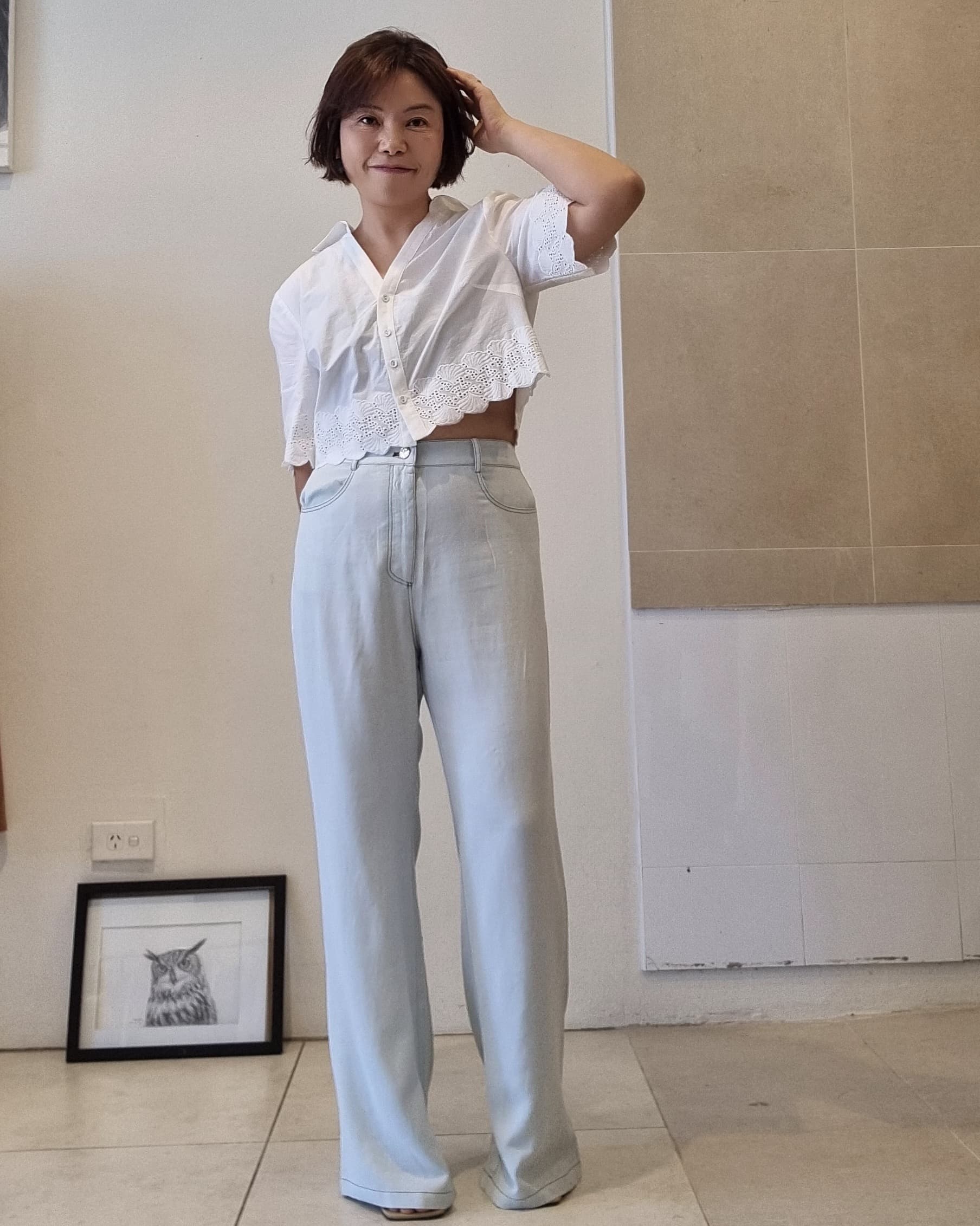 Light blue Tencel wide-leg pants with high-waist fit, full-length front view