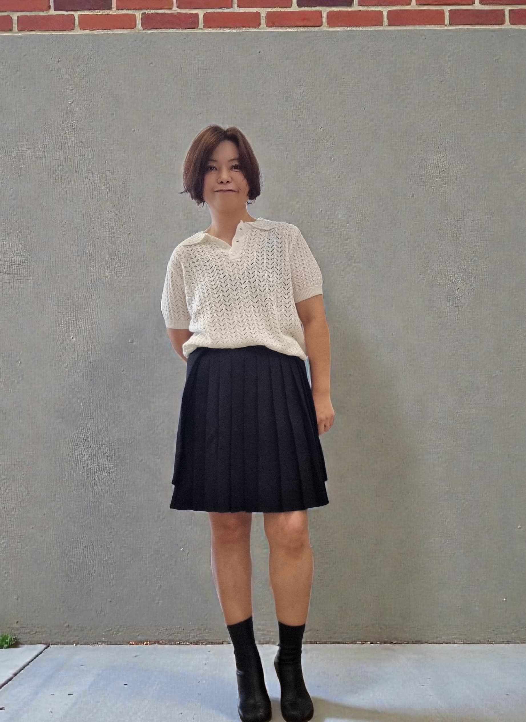 Model wearing cream lace collar knit top with delicate texture