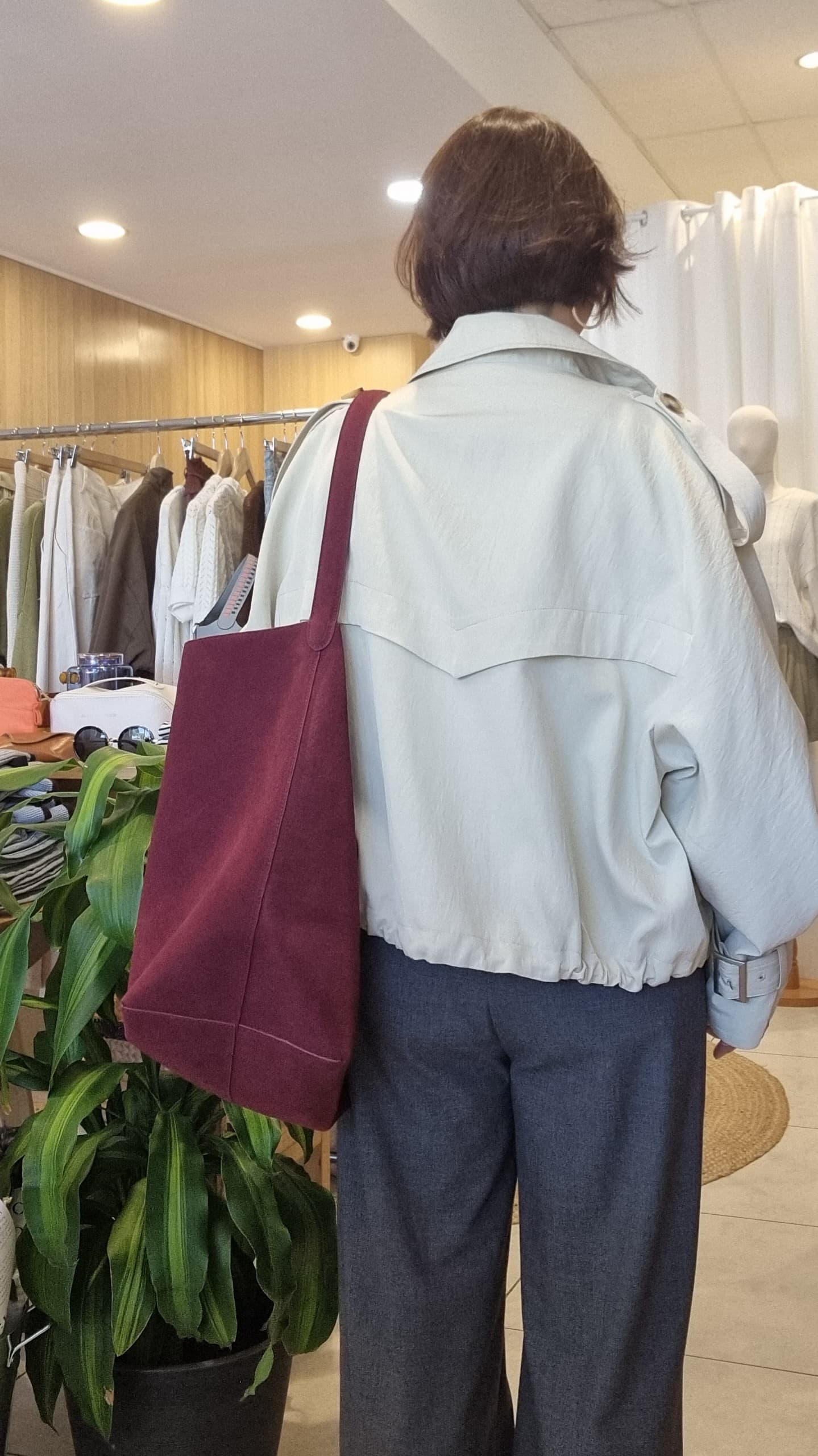 Back view of Cream Breeze Short Trench showing clean back design