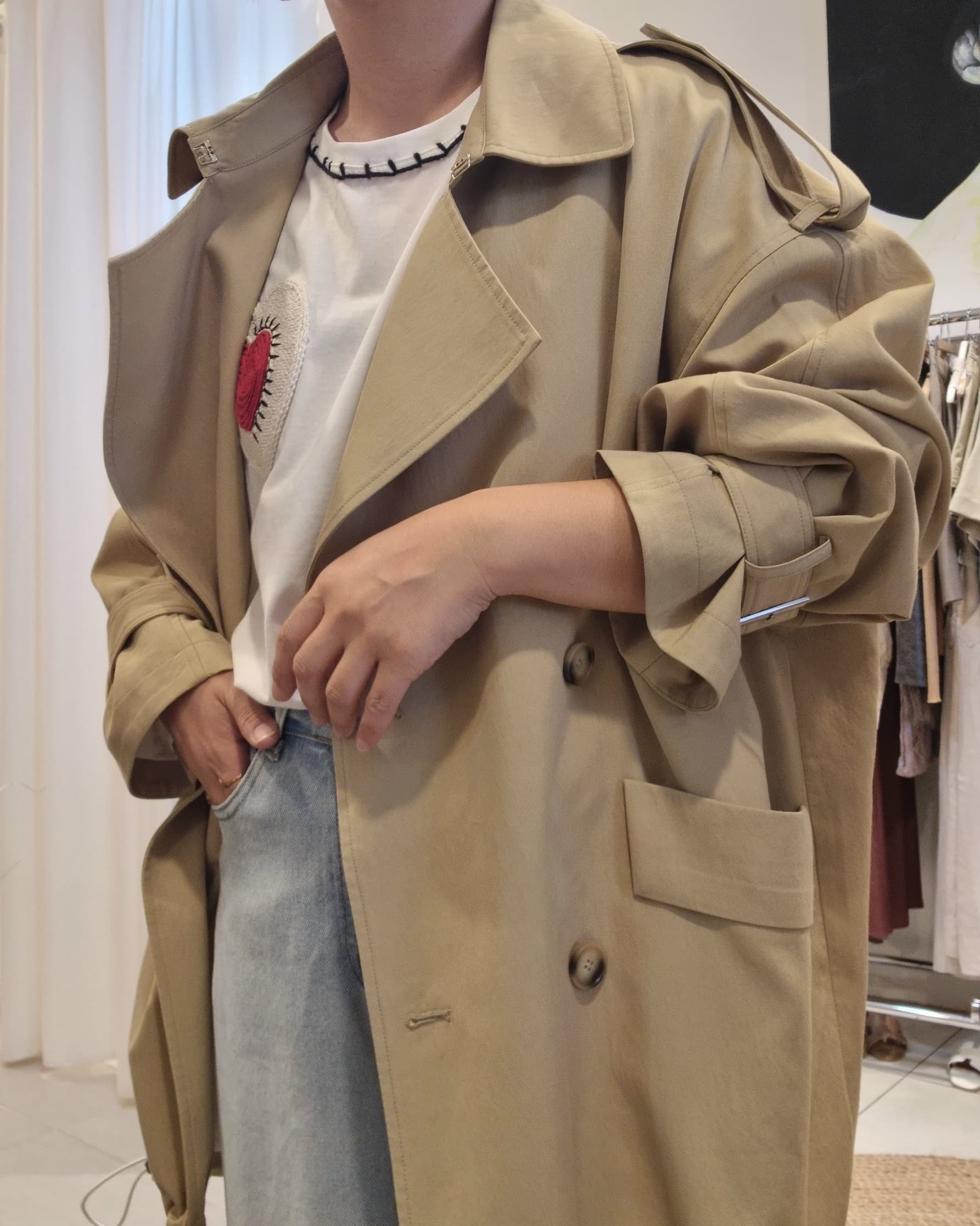 Model side view wearing Beige Luxe Trench Coat with jeans