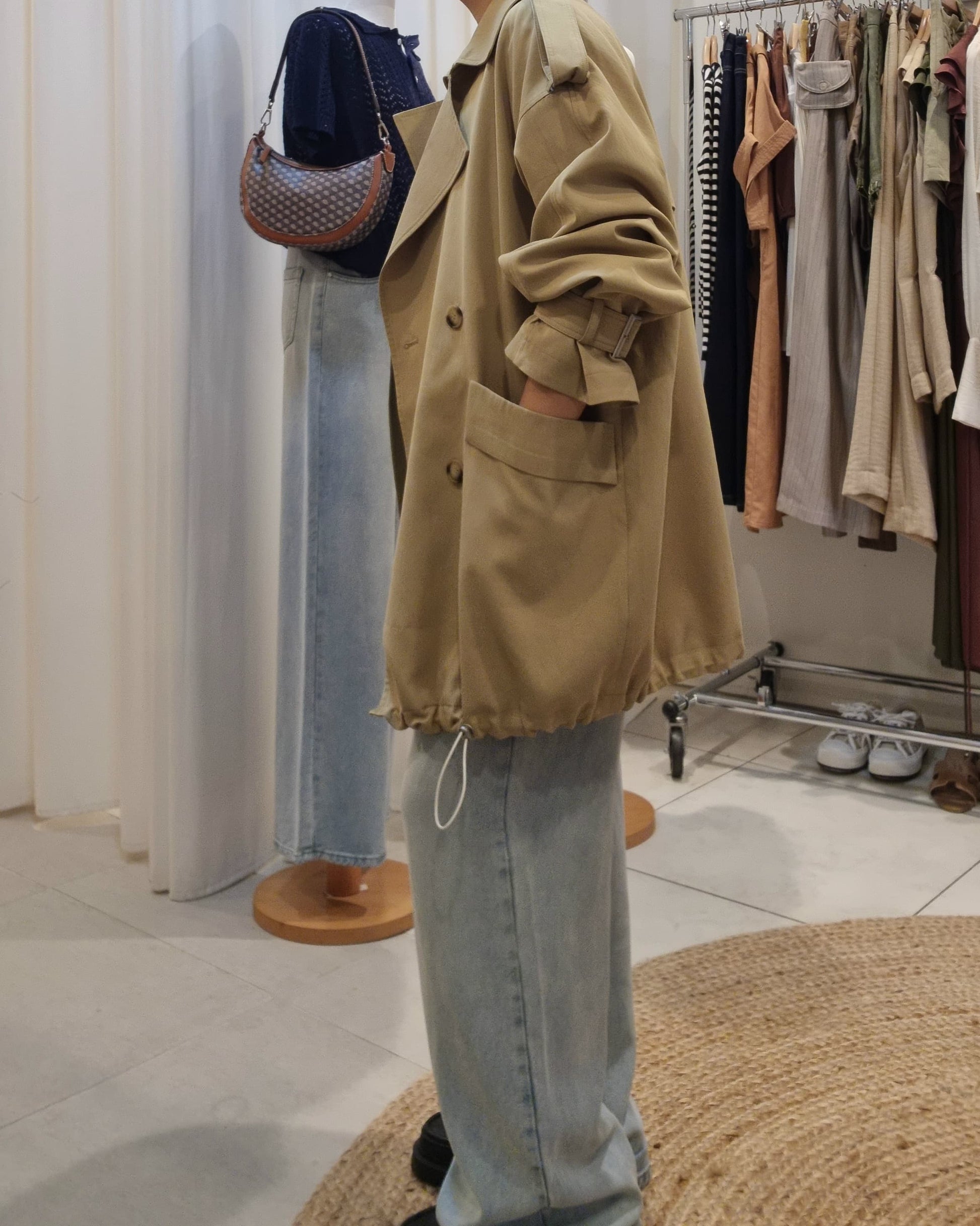 Model side view wearing Beige Luxe Trench Coat