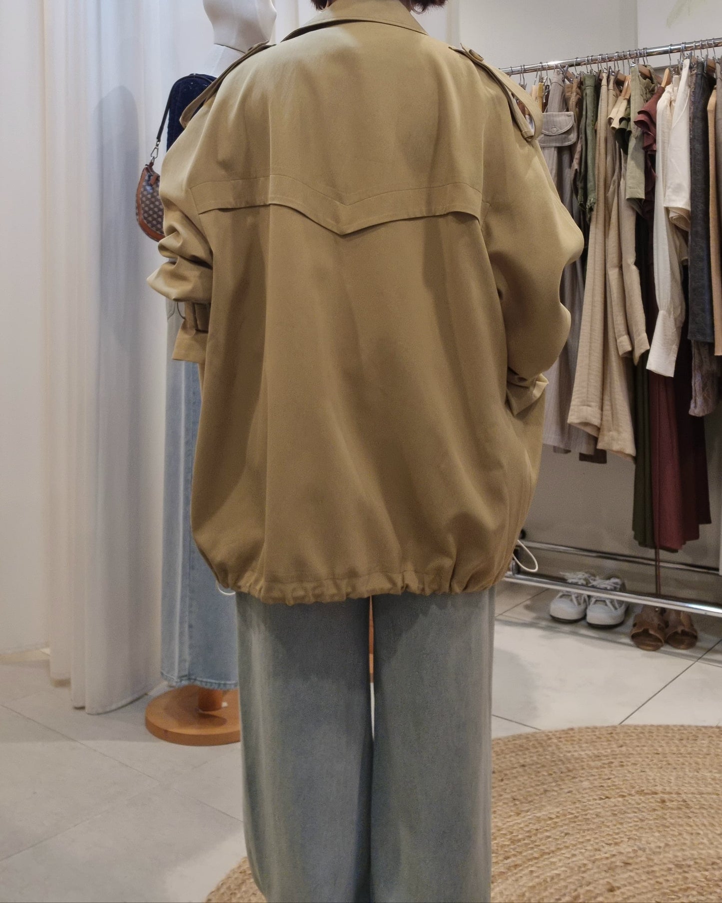 Model back view wearing Beige Luxe Trench Coat