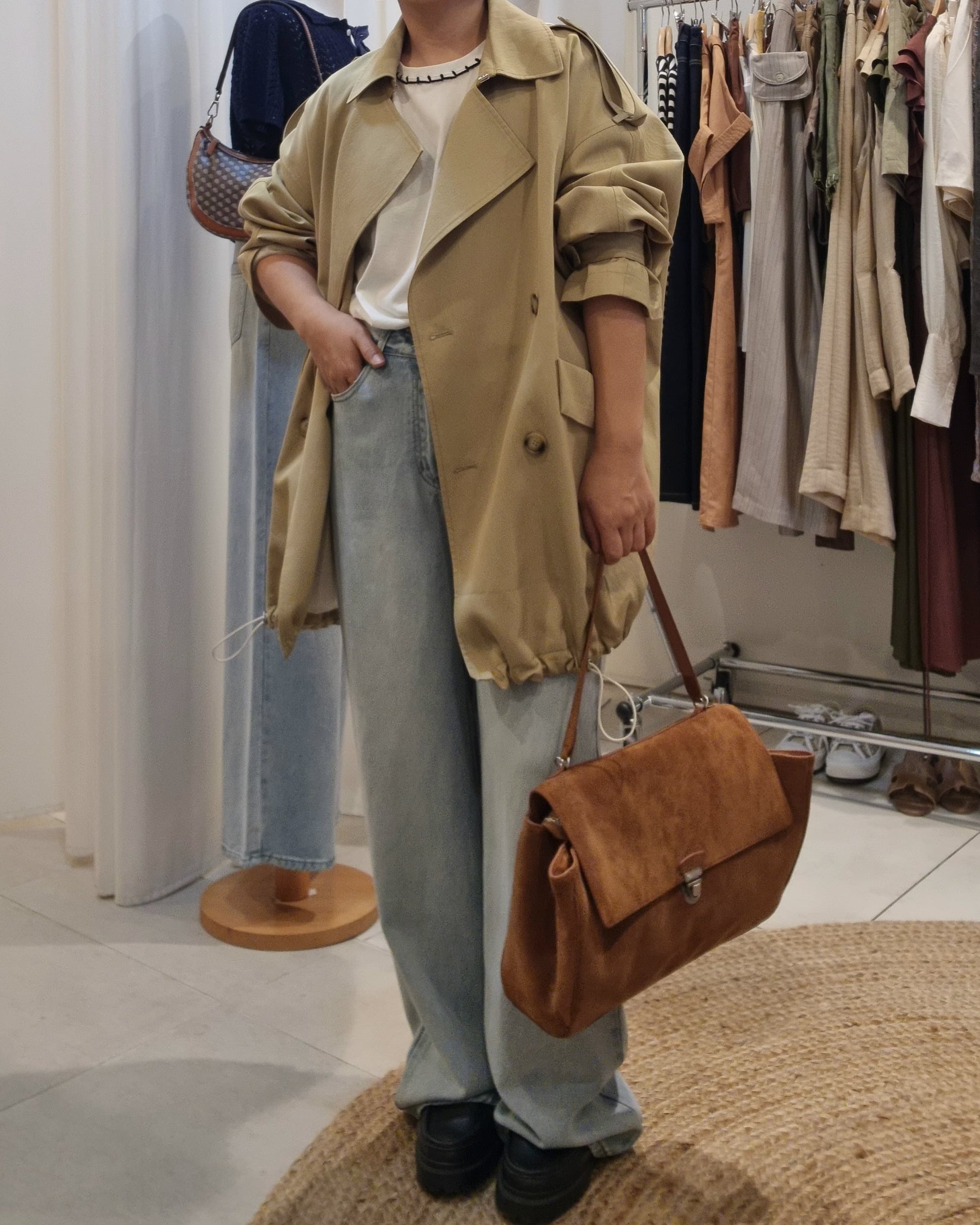 Model front view wearing Beige Luxe Trench Coat with  brown bag