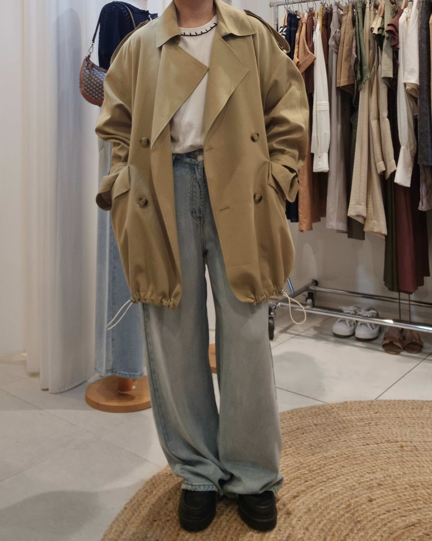 Model front view wearing Beige Luxe Trench Coat with jeans and black shoes