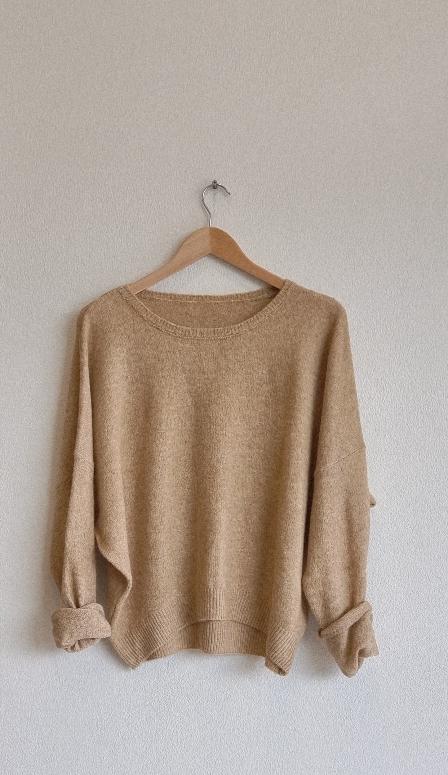 Beige wool blend loose fit knit sweater on hanger