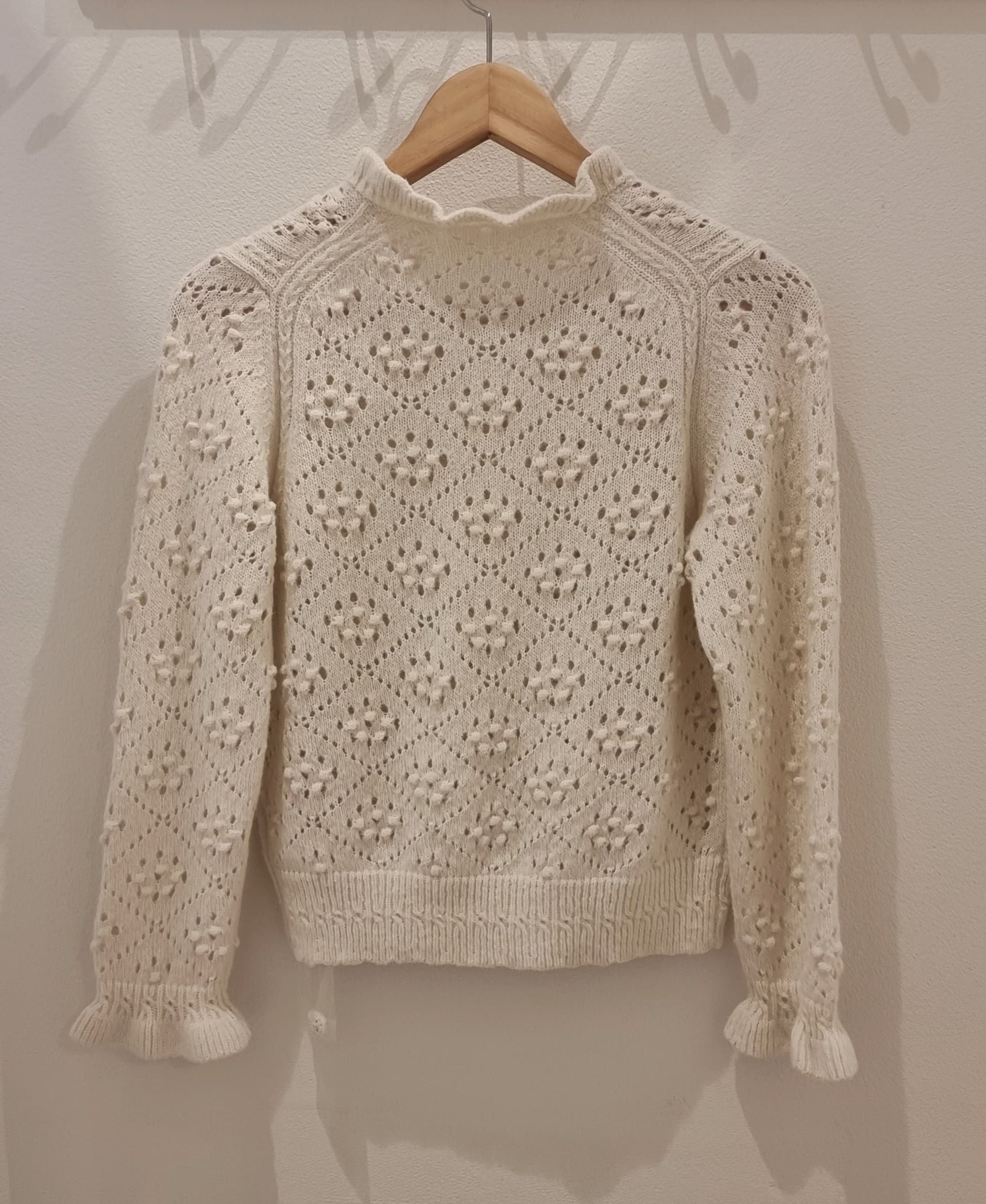 Back view of cream alpaca blend textured knit cardigan