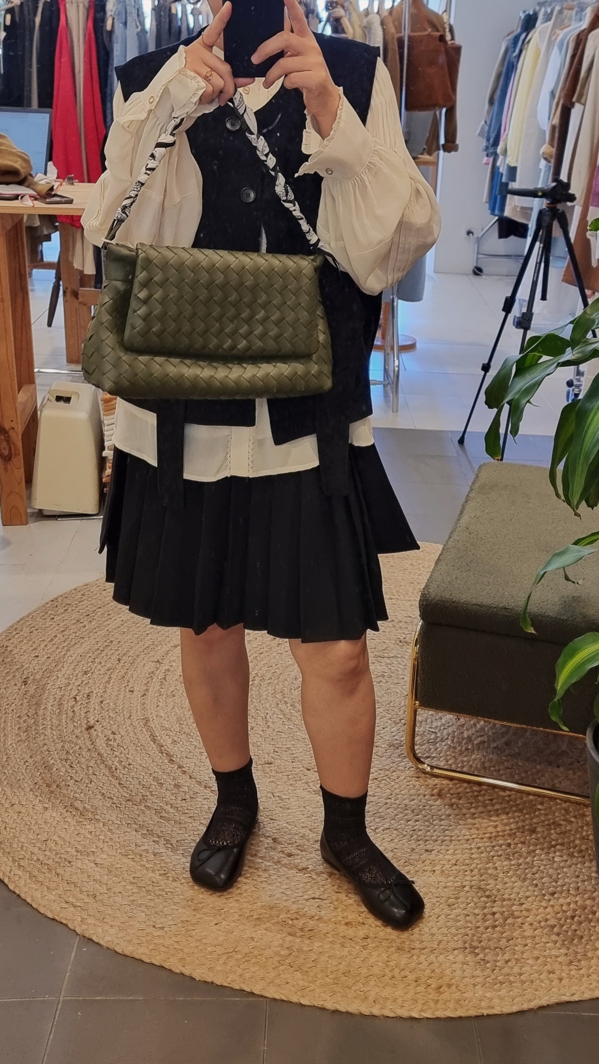 Black corduroy vest outfit with skirt and loafers, casual chic styling