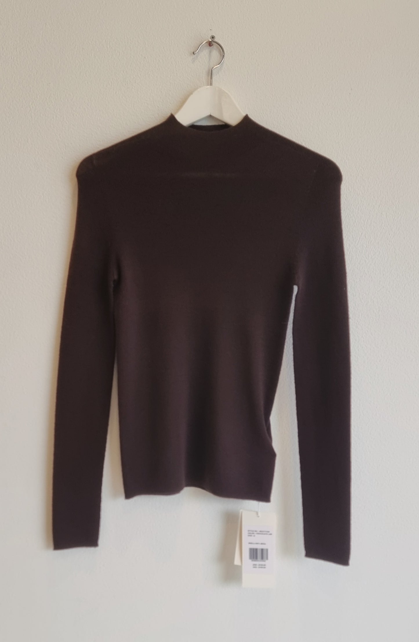 Brown wool sweater on hanger
