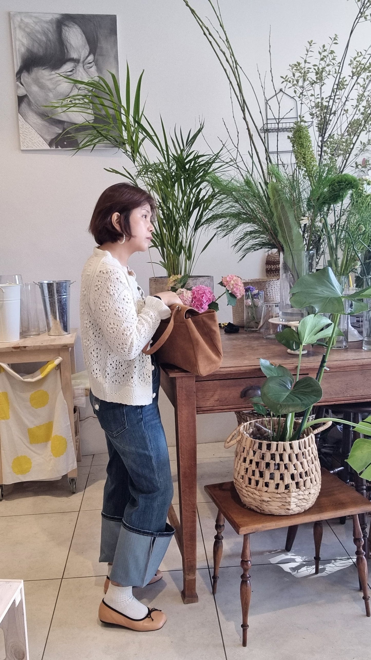 Side view of woman wearing cream alpaca ruffle knit cardigan
