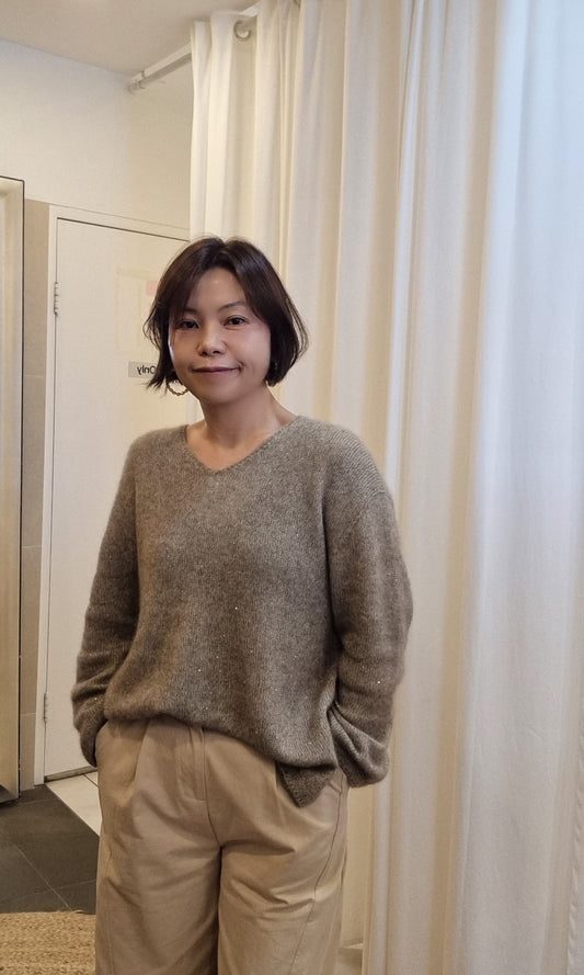 model wearing beige shimmer cashmere blend v neck knit front view