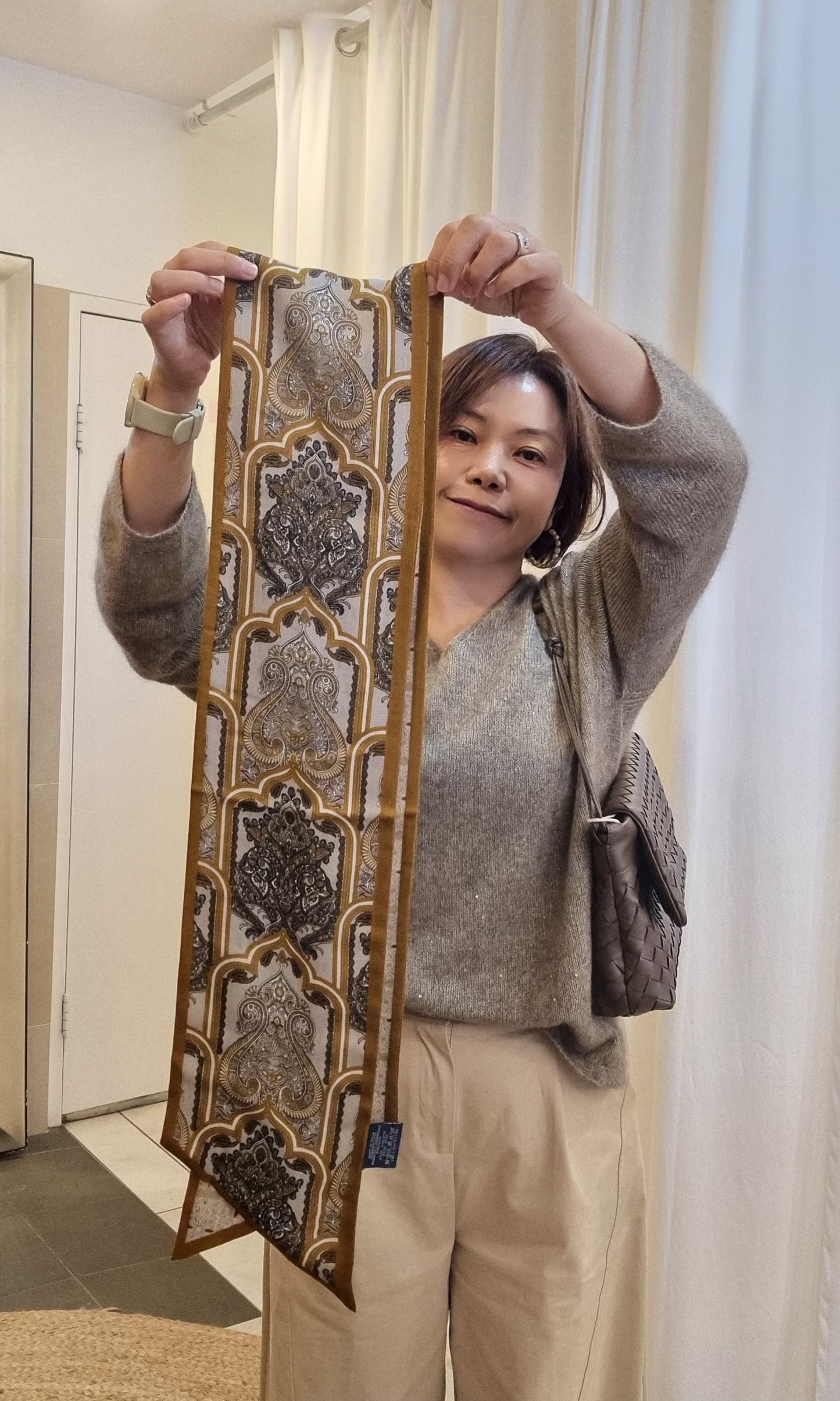 woman holding cashmere silk pattern scarf front view