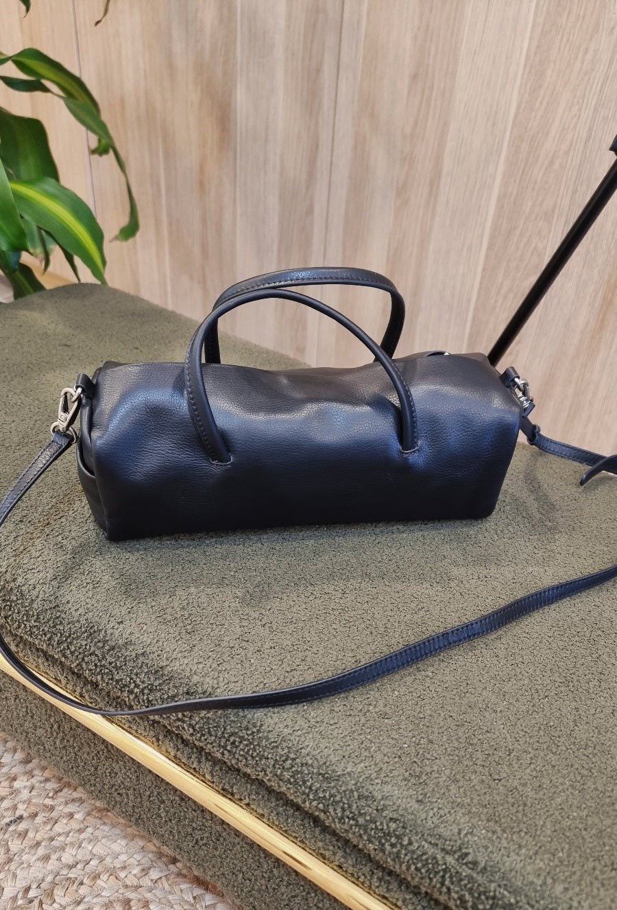 black leather cylinder bag top handle detail