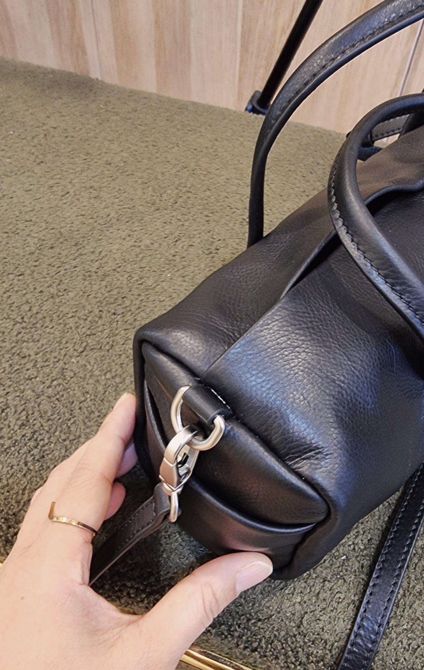 black leather cylinder bag leather texture close up