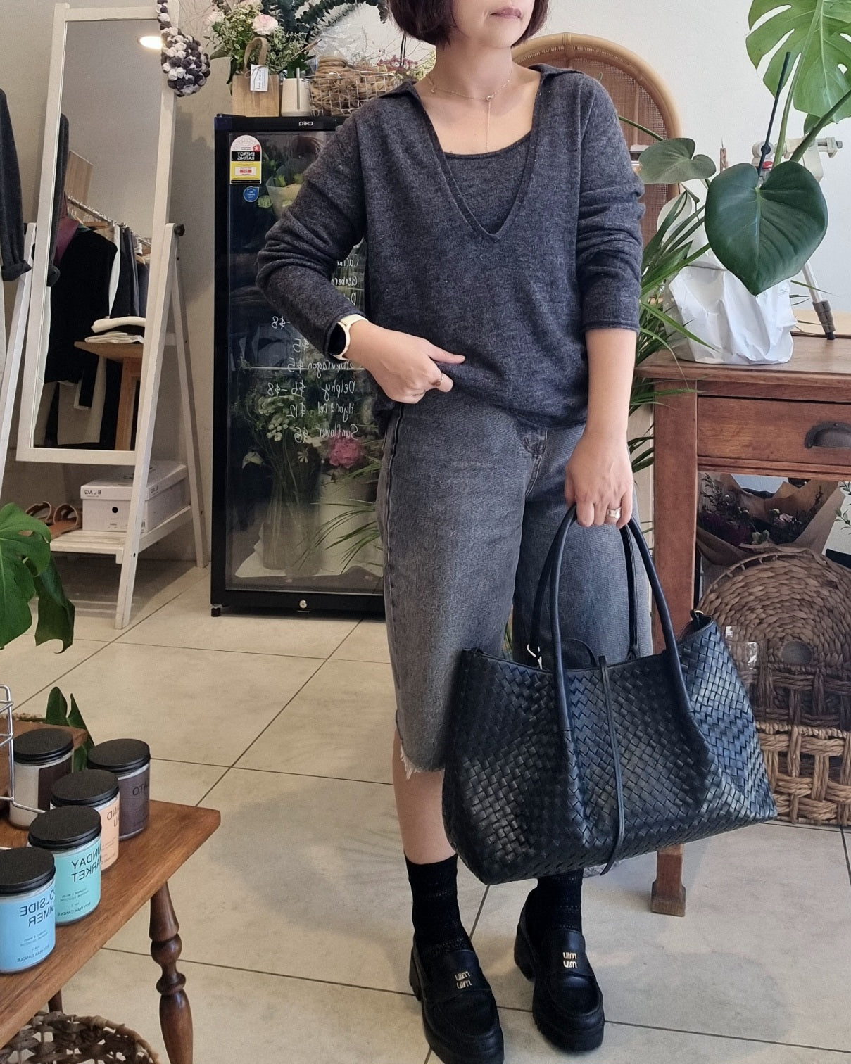 Model wearing a soft grey knit tank set with relaxed fit
