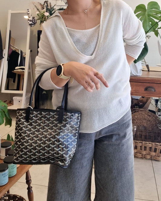 Model wearing a soft white knit tank set with relaxed fit