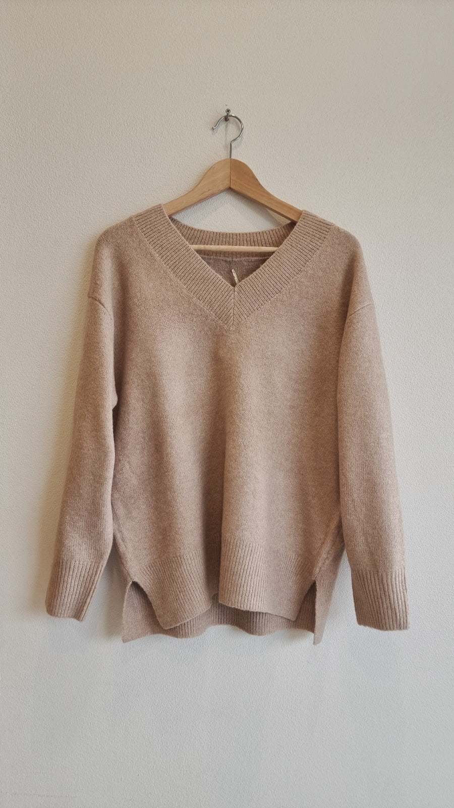 Relaxed fit V-neck sweater available in light blue and beige