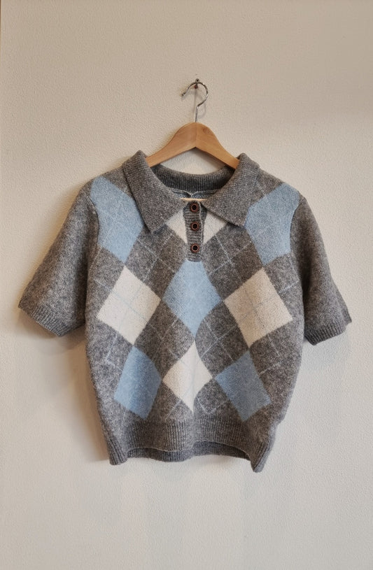 argyle knit short sleeve sweater front view on hanger