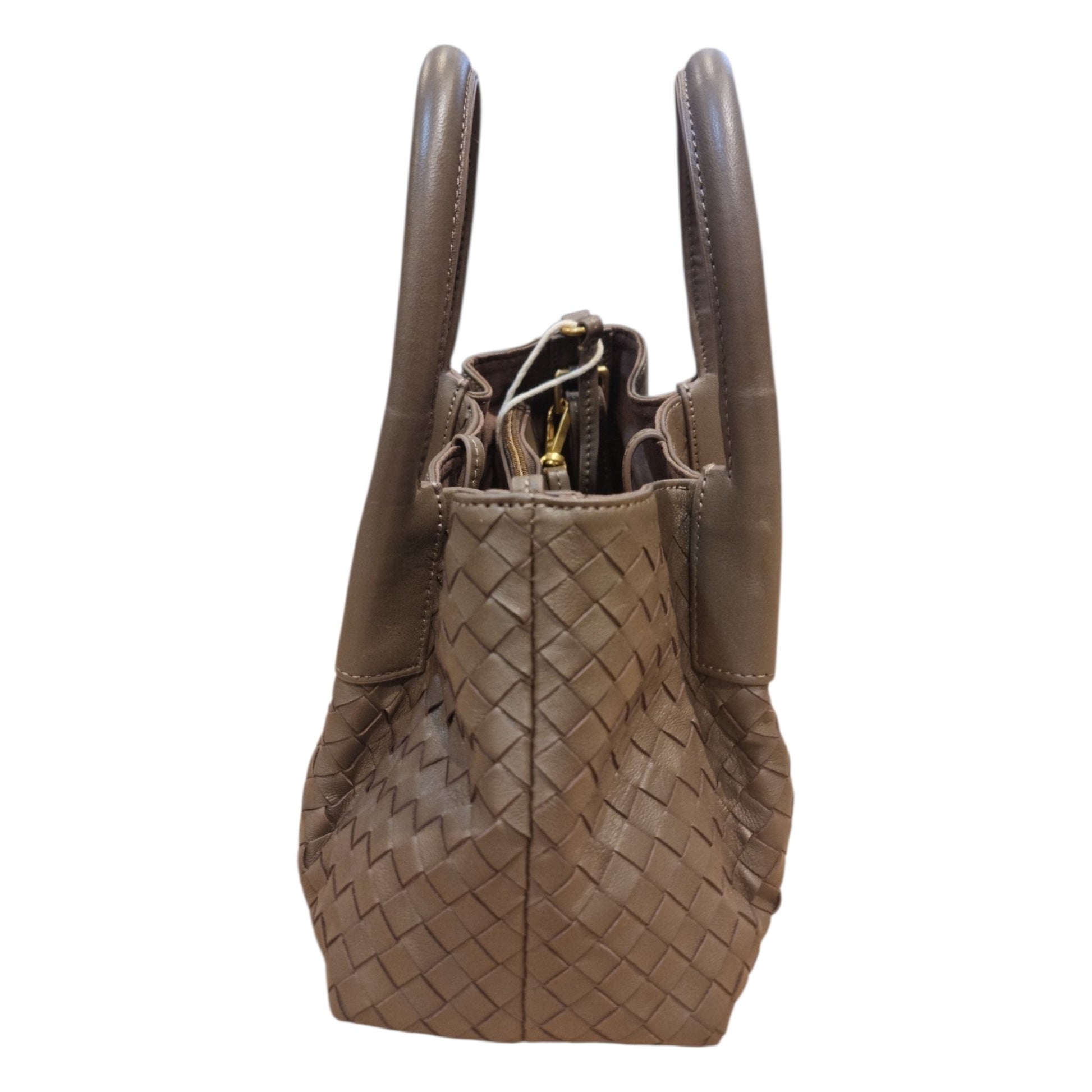 Brown woven leather handbag side profile detail