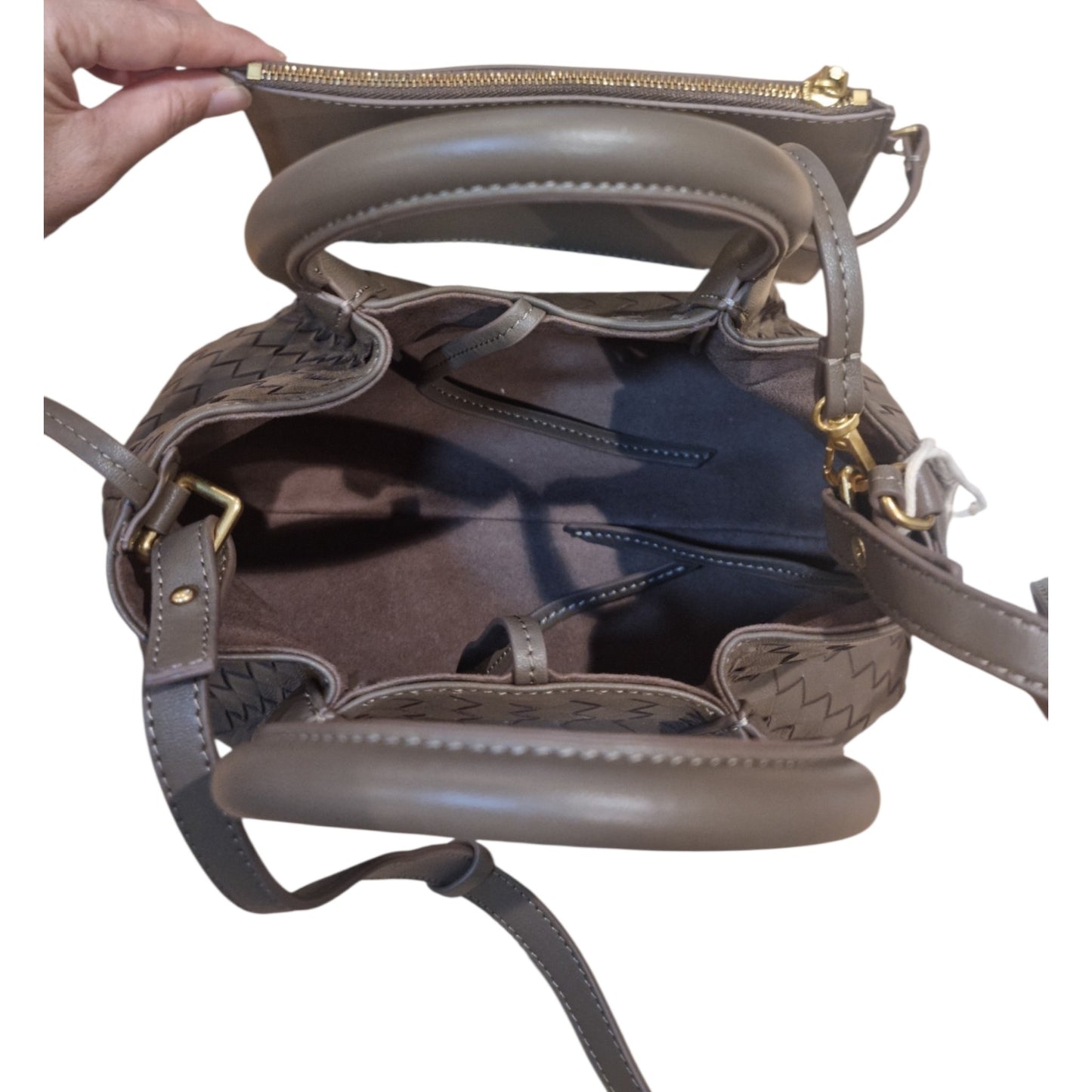 Interior view of woven leather tote bag with pouch included