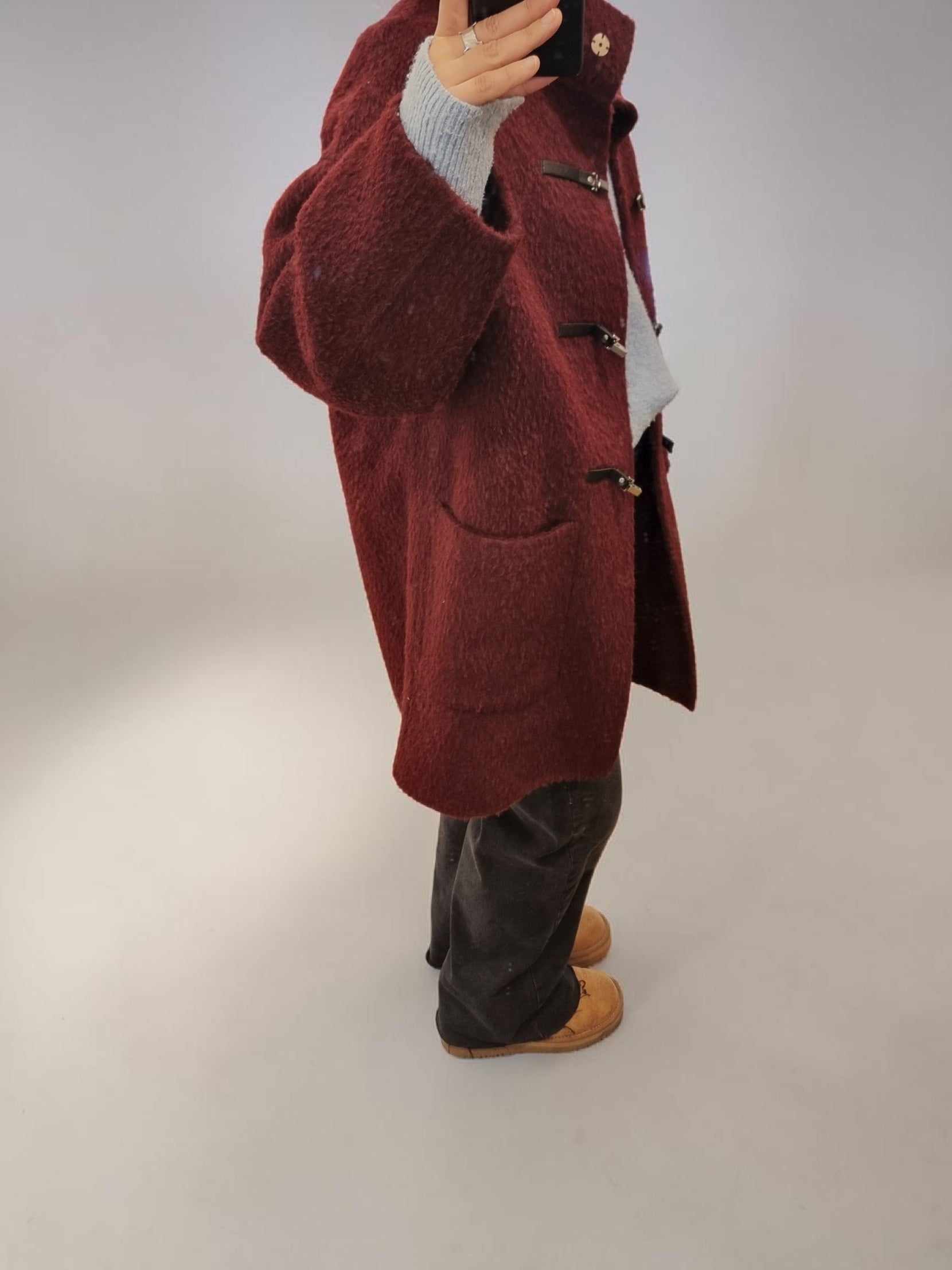 Women's burgundy winter coat side profile styling