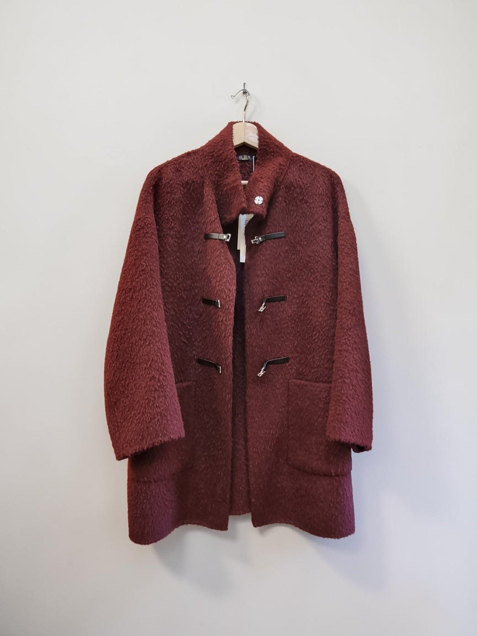 Burgundy wool cashmere coat front hanging display