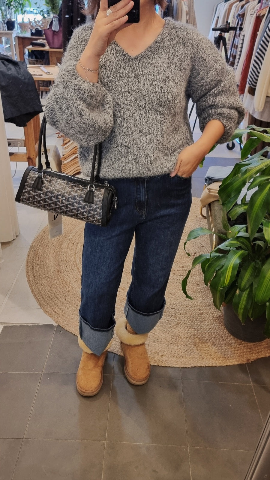 Grey soft wool blend knit sweater with relaxed fit styled with denim jeans