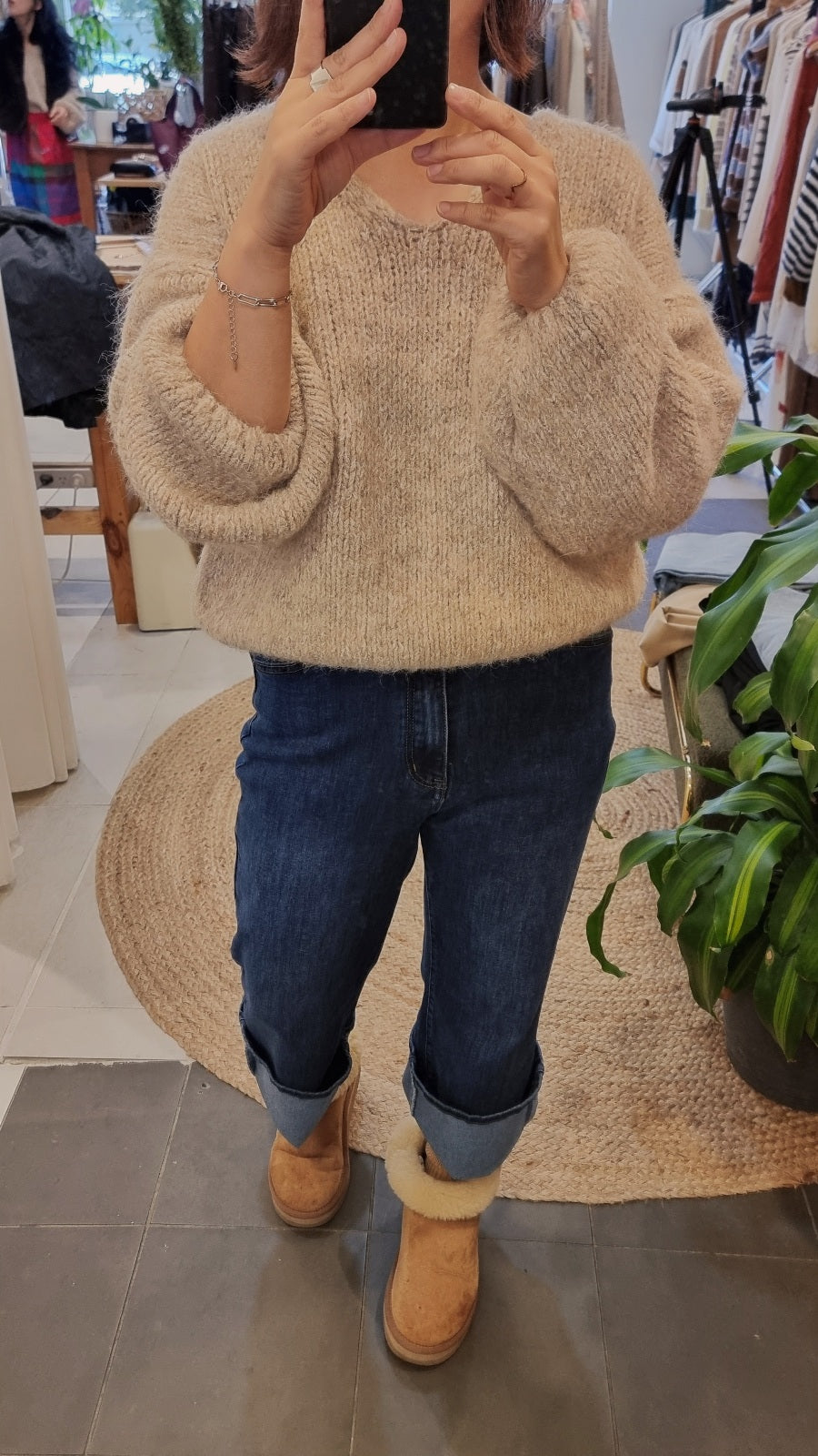 Soft wool blend knit sweater in beige styled with denim jeans