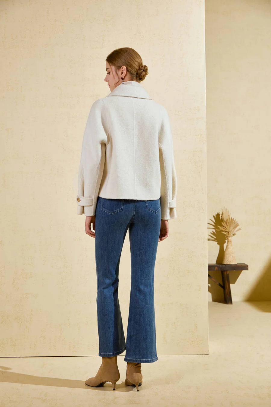 Back view of Luciano short wool coat highlighting modern boxy shape