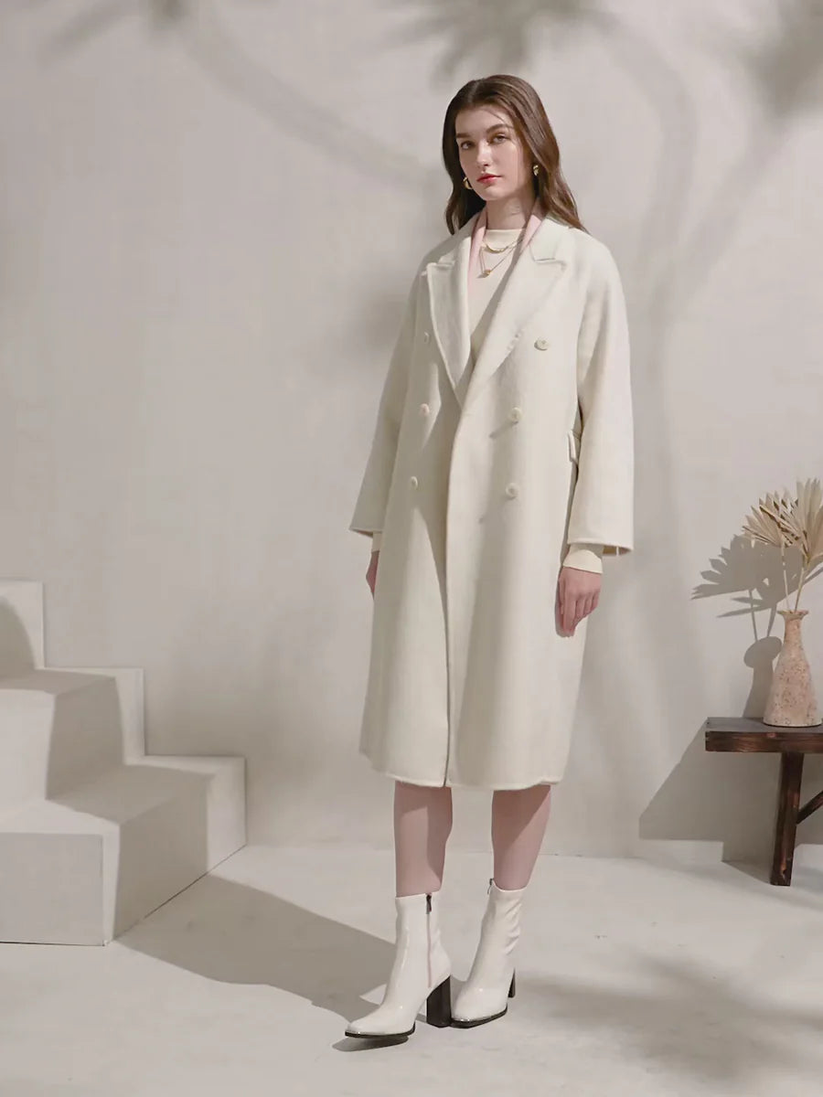 Side angle view of cream merino wool coat showing length and structure