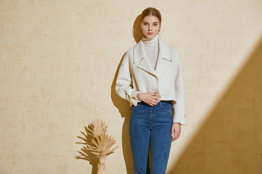 Full body front look of model styling the Luciano short coat with trousers