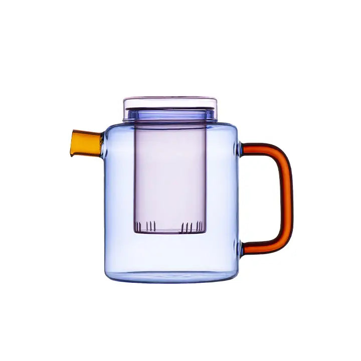 Blue glass Cha Pot with an amber handle and yellow spout on a white background