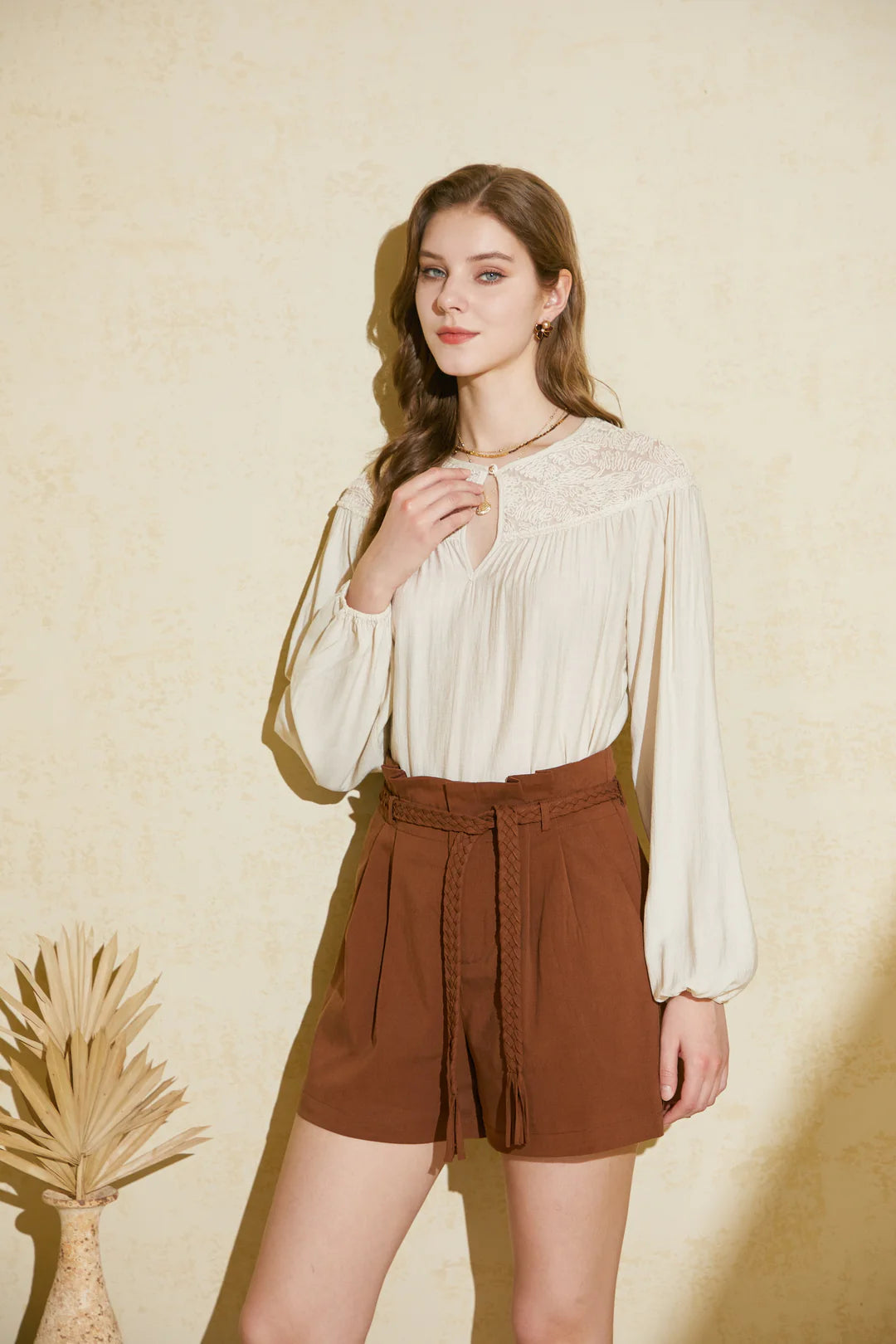 Full outfit view—brown belted shorts styled for casual everyday look