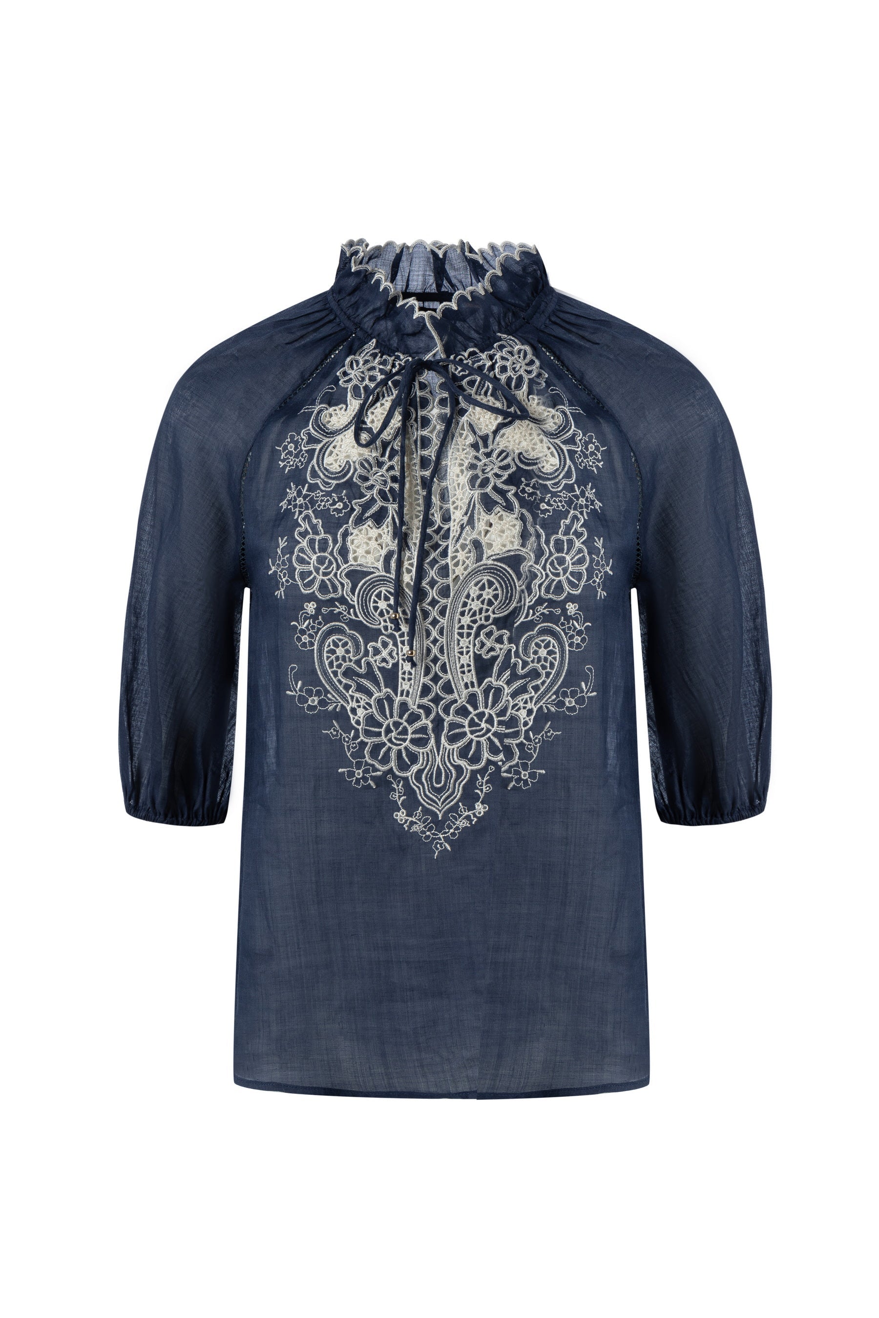 "Navy embroidered blouse with white floral lace detail on a white background."