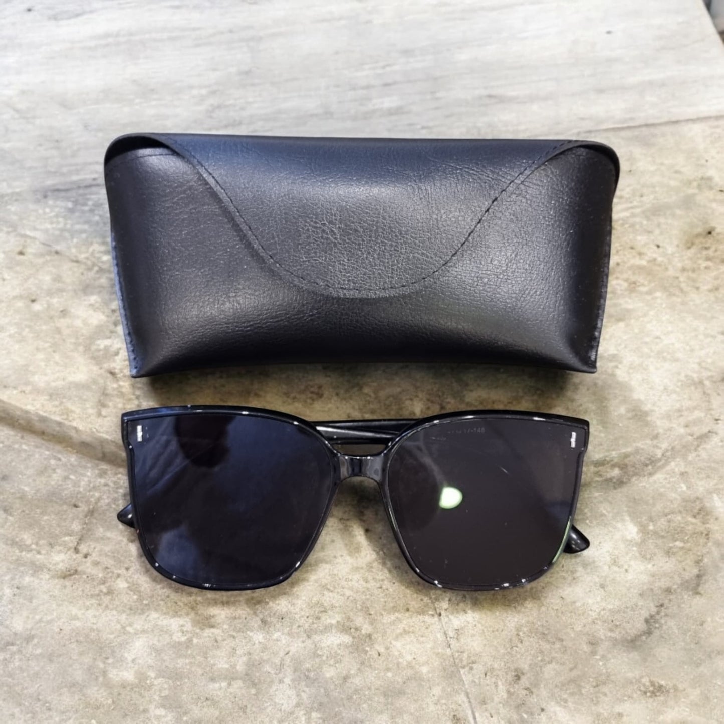 Closed black sunglasses case on grey background – Nova Lux