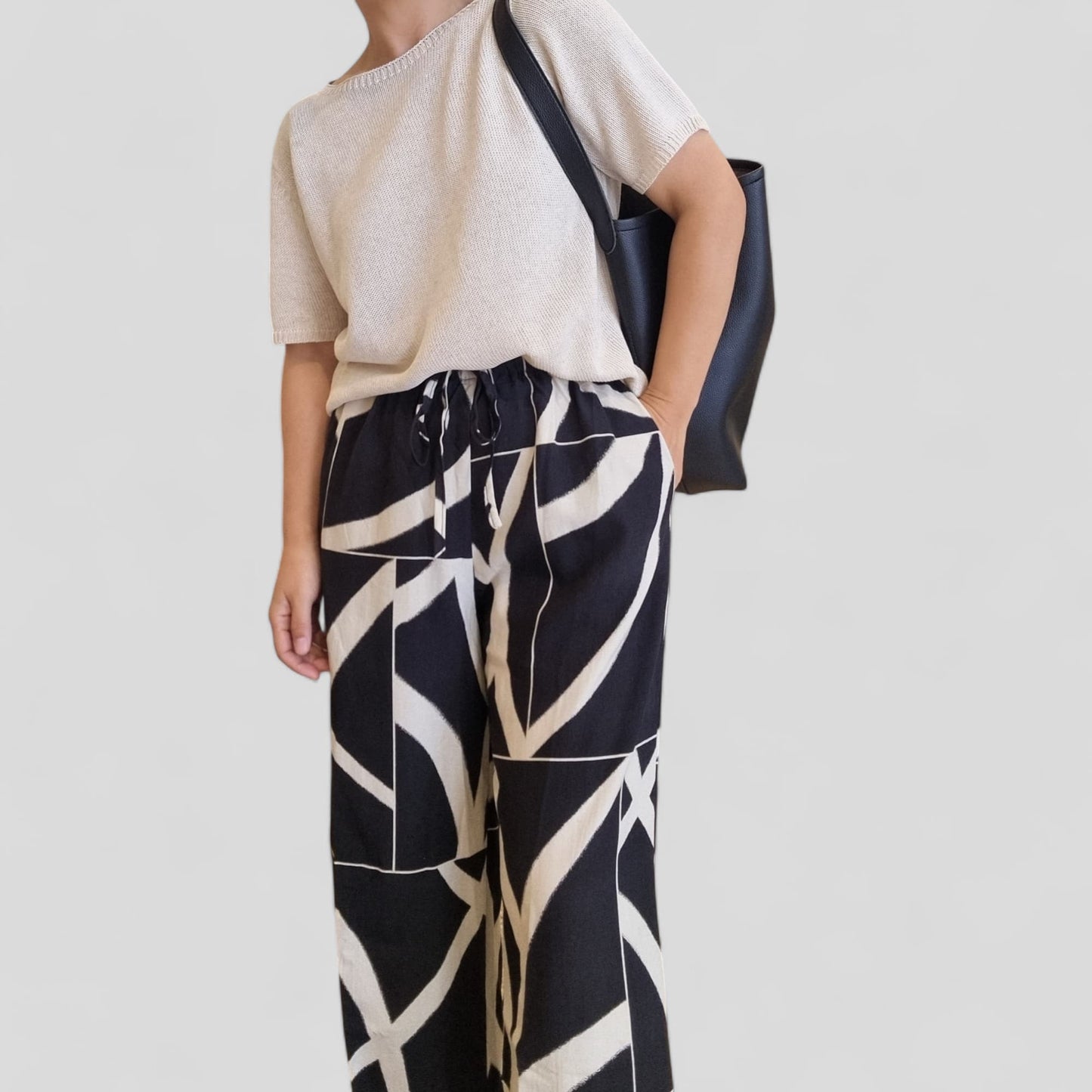 Summer knit top styled with patterned pants front pose – Nova Lux
