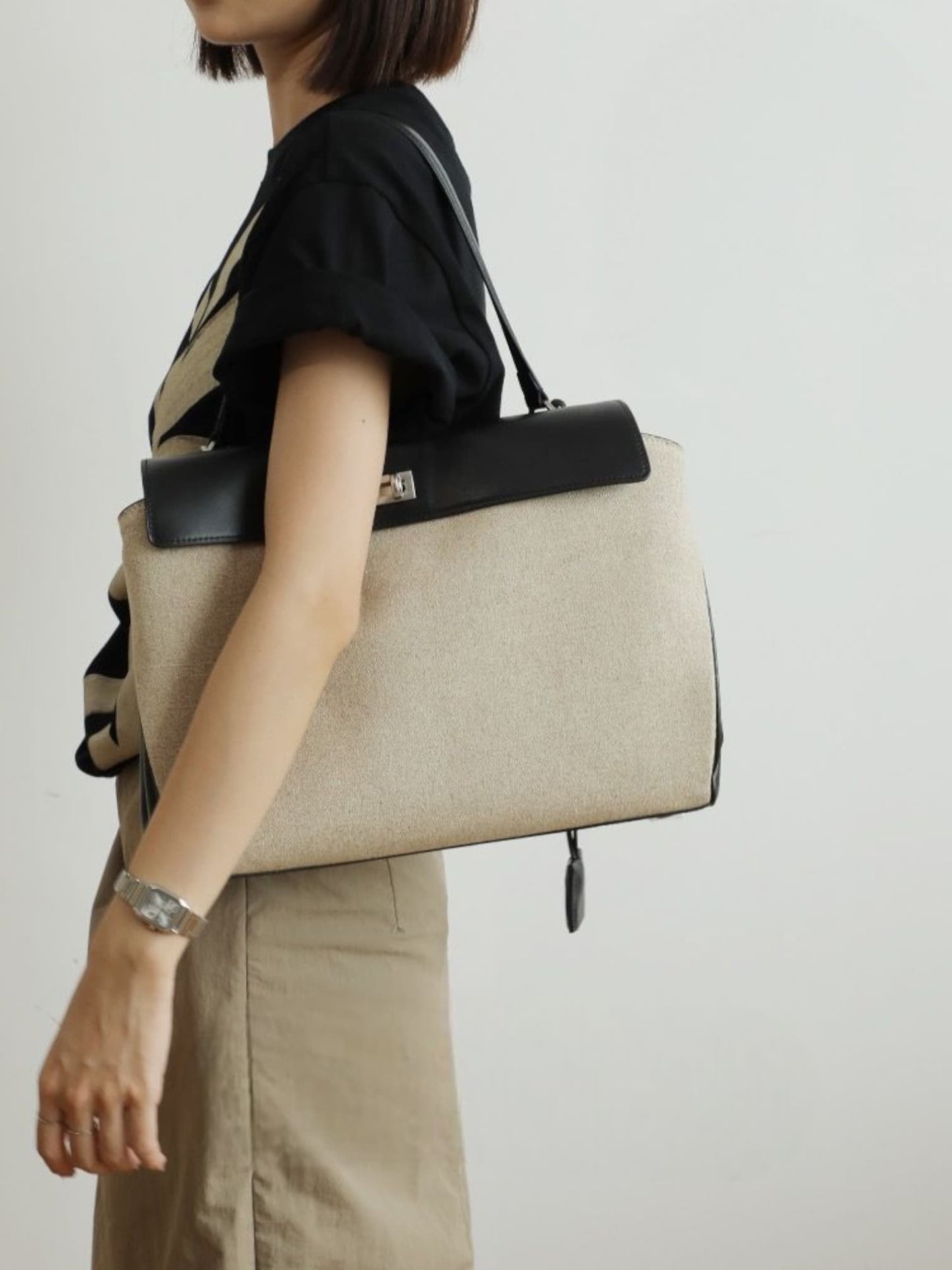 Model wearing canvas shoulder bag – side profile